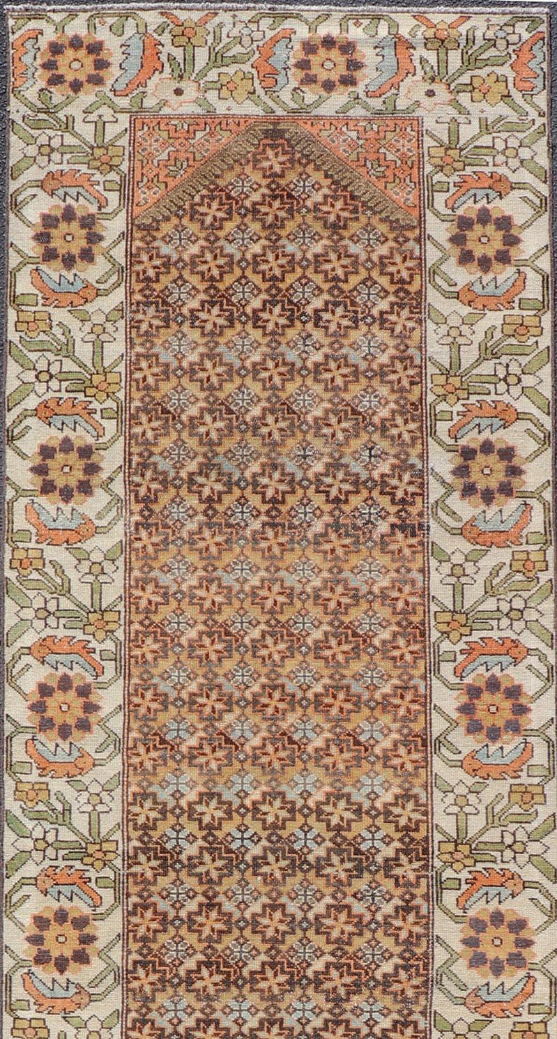 Colorful Antique Persian Bakhtiari Runner with All-Over Floral and Tribal Border In Good Condition For Sale In Atlanta, GA