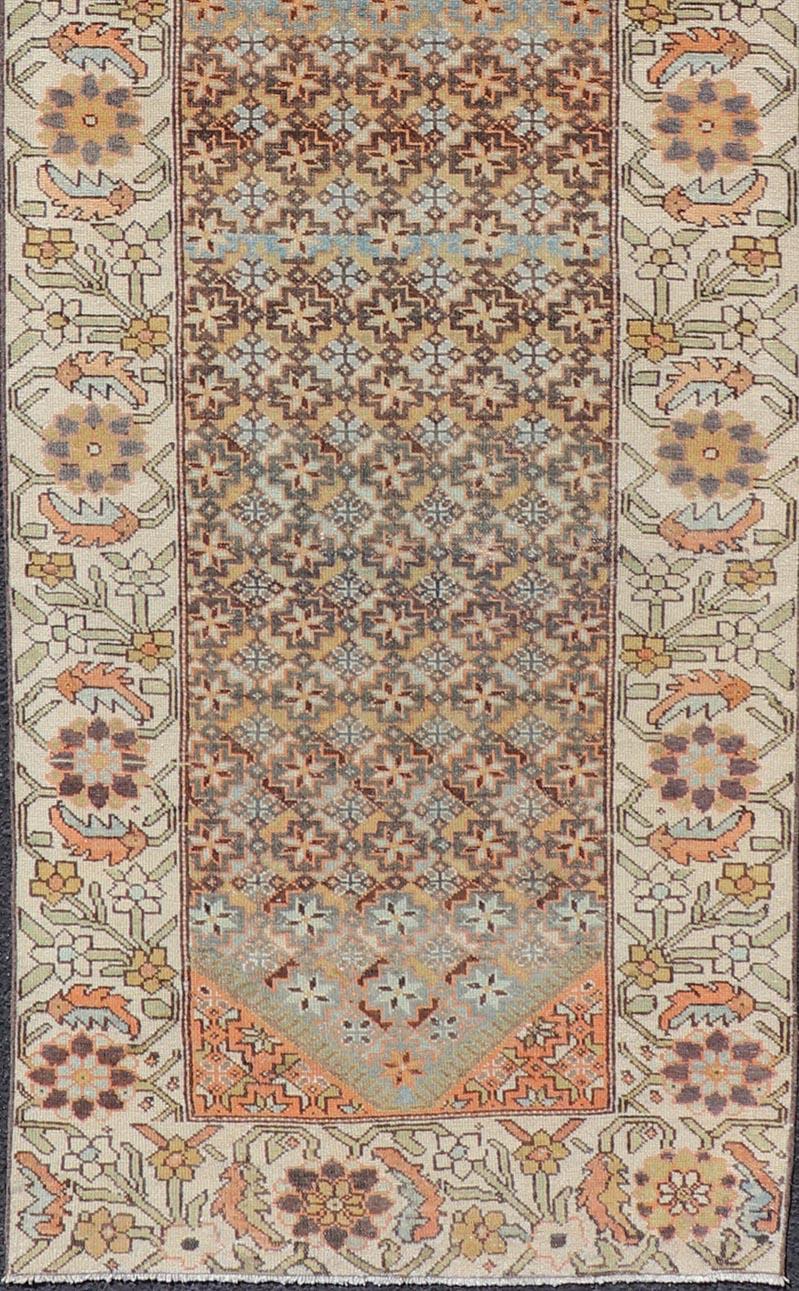 Wool Colorful Antique Persian Bakhtiari Runner with All-Over Floral and Tribal Border For Sale