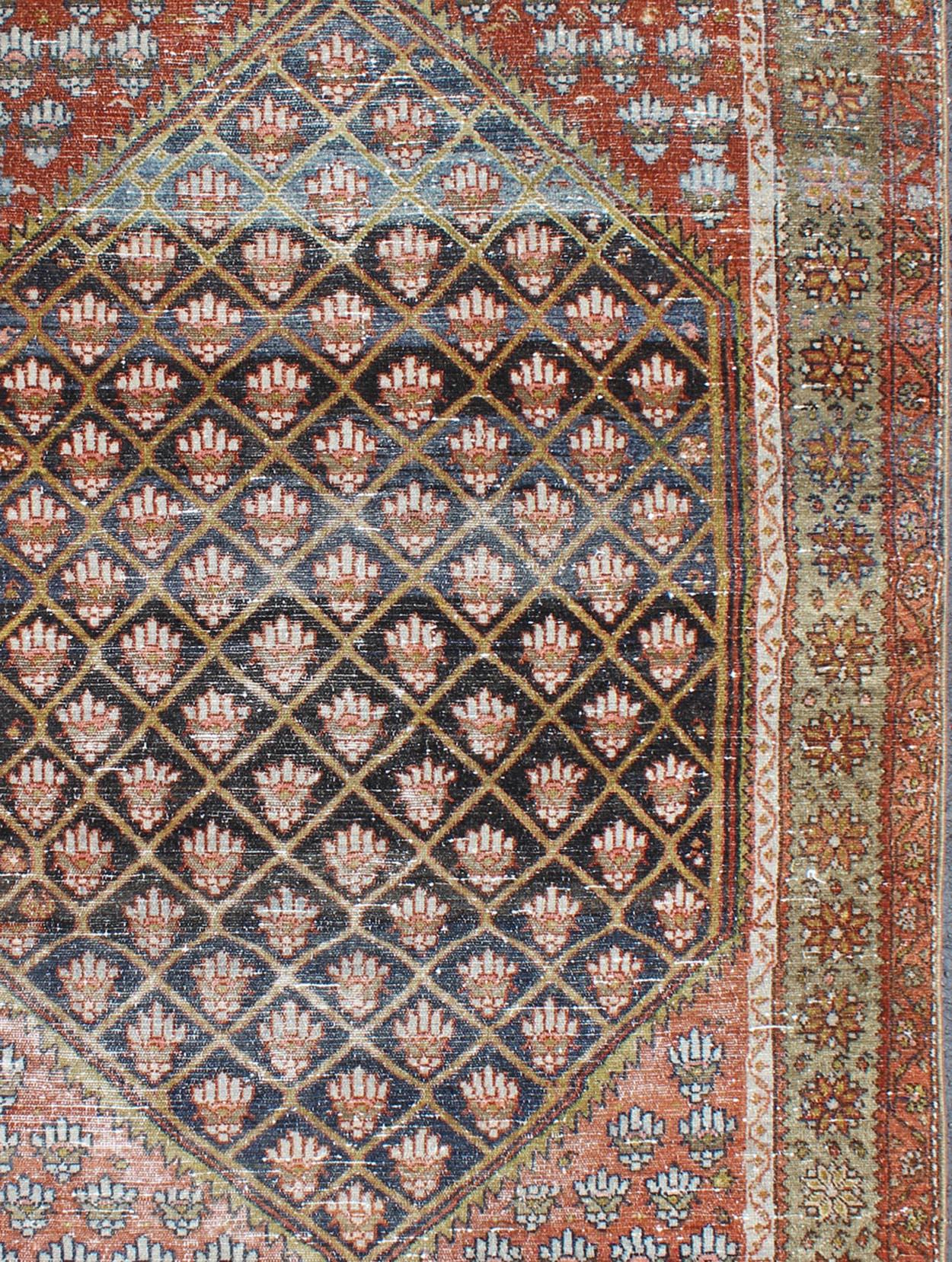 Antique Persian Hamadan rug with gorgeous blue and colorful design. Keivan Woven Arts / rug GNG-4762, country of origin / type: Iran / Hamadan, circa 1920.

This antique Persian Hamadan rug (circa early 20th century) features a unique blend of