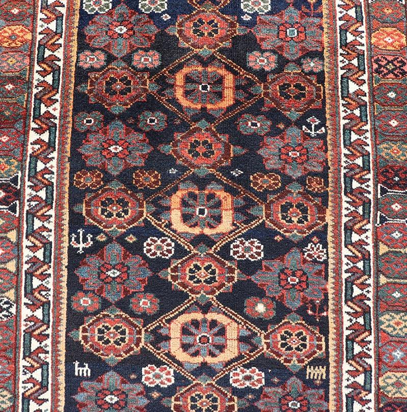 Hand-Knotted Colorful Antique Persian Lori Runner with Repeating Floral Palmette Design For Sale