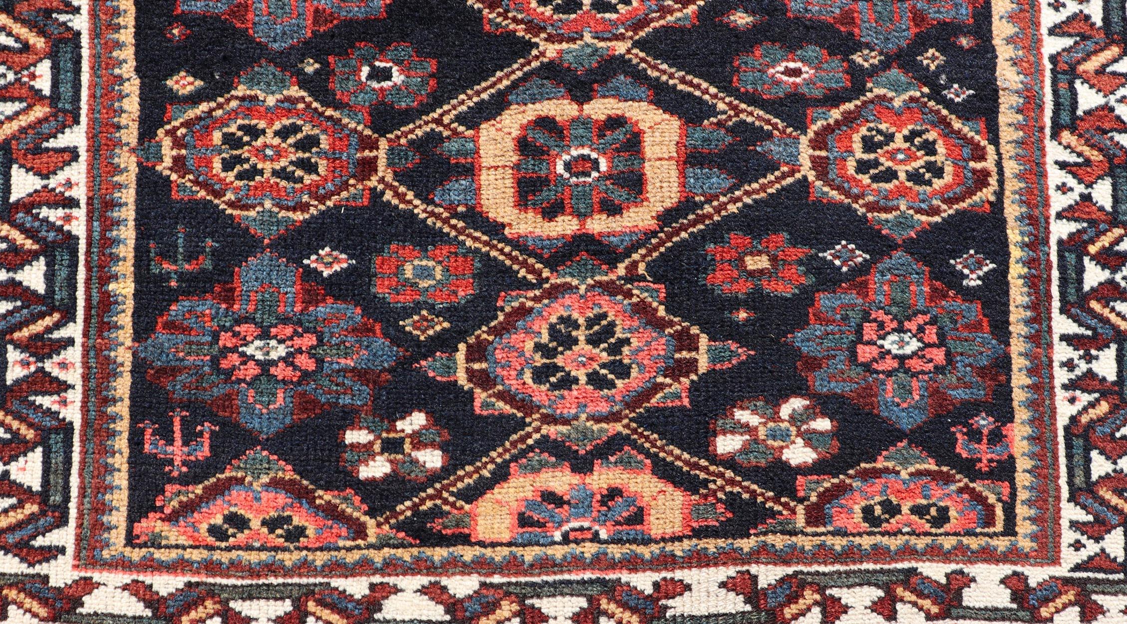 20th Century Colorful Antique Persian Lori Runner with Repeating Floral Palmette Design For Sale