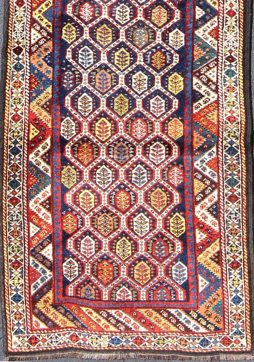 Lori antique Persian runner in multi-colors with all-over geometric leaf design, rug ema-7576, country of origin / type: Iran / Mahal, circa 1900

This antique Persian Malayer runner, circa early 20th century, relies heavily on exquisite details