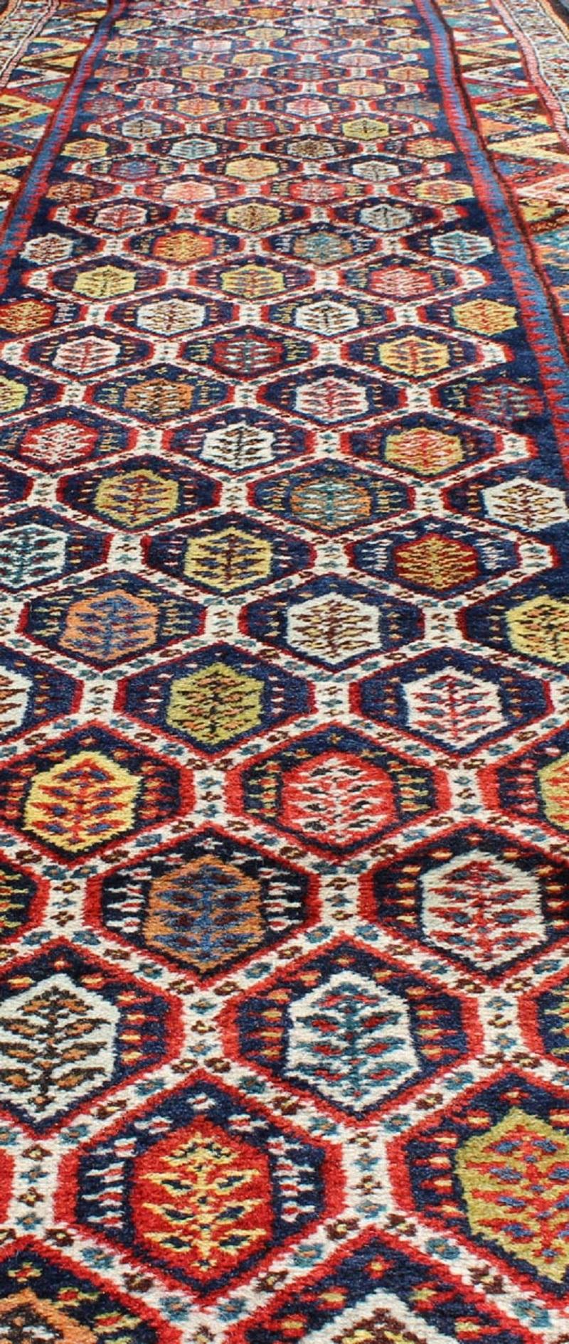 Early 20th Century Colorful Antique Persian Lori Runner with Repeating Geometric Palmette Design For Sale