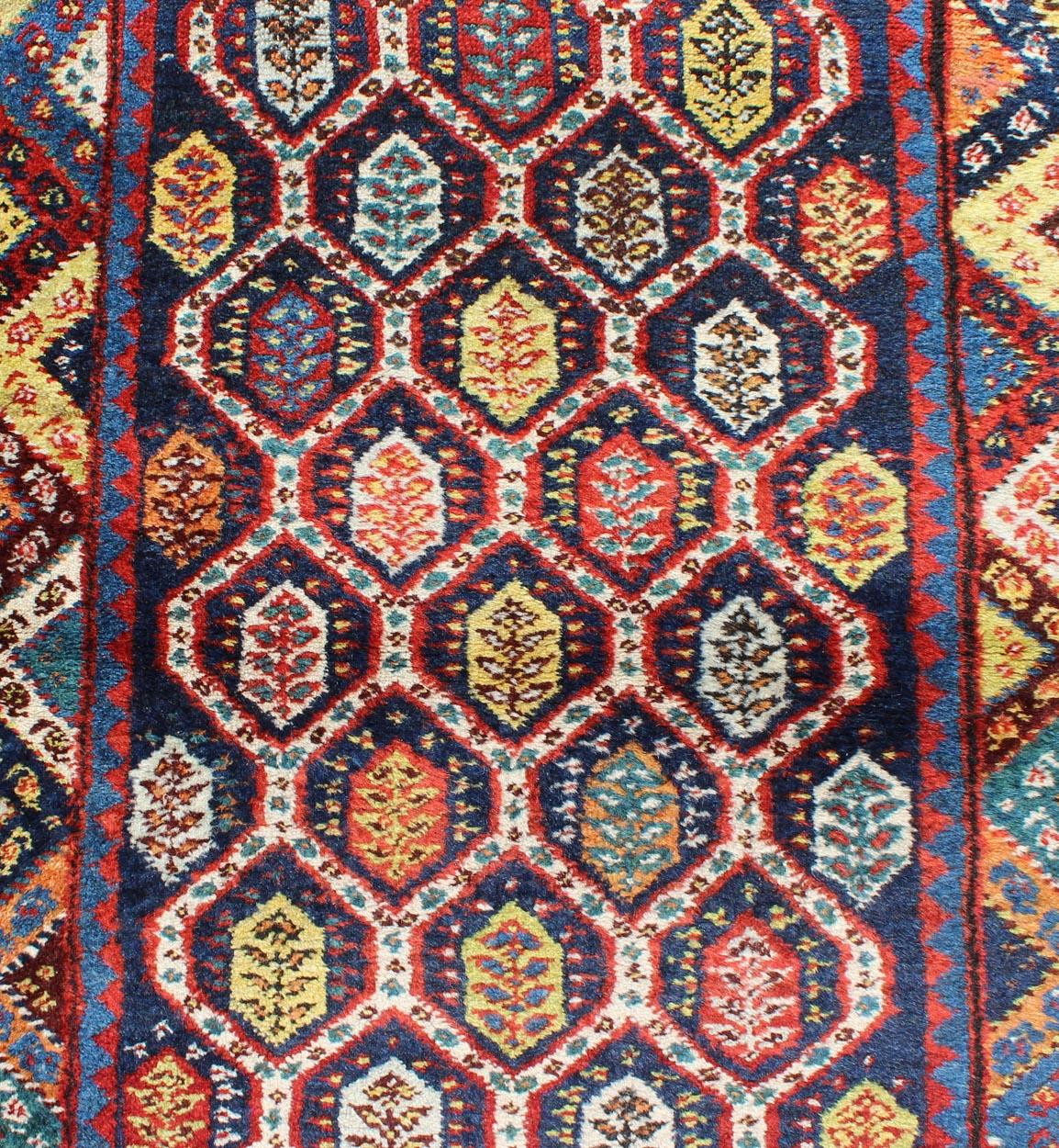 Wool Colorful Antique Persian Lori Runner with Repeating Geometric Palmette Design For Sale