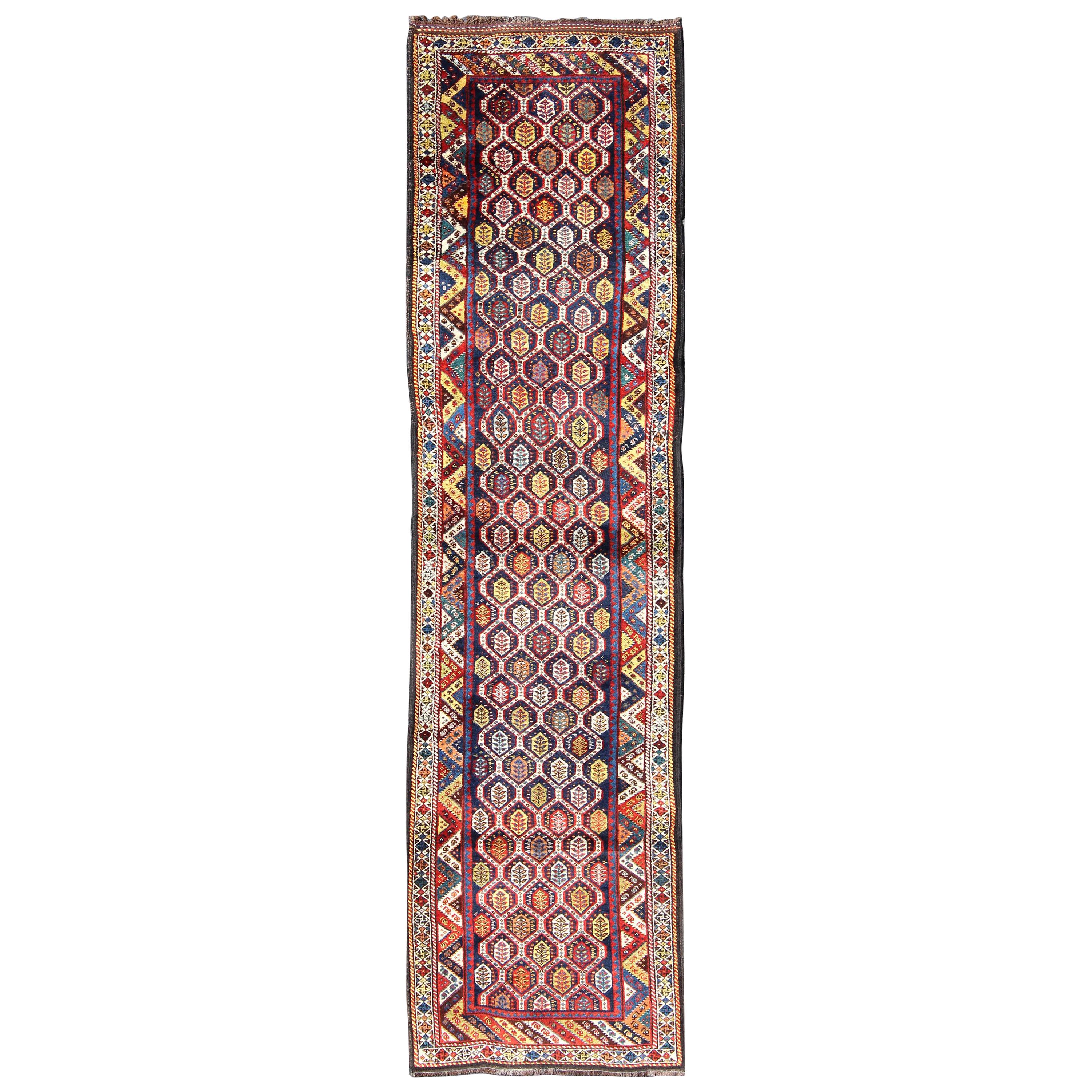 Colorful Antique Persian Lori Runner with Repeating Geometric Palmette Design For Sale