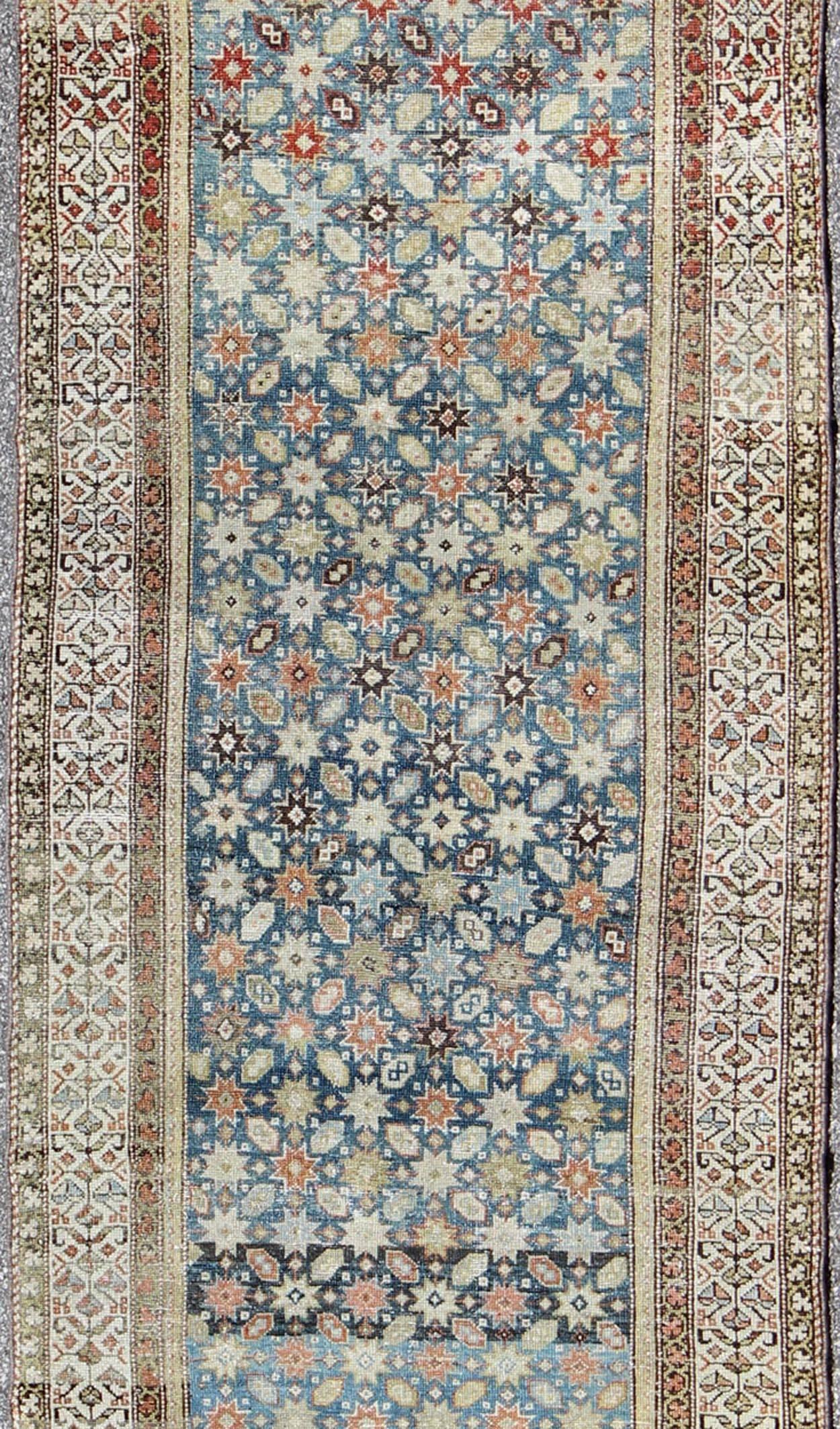 Colorful Antique Persian Malayer Runner with Blue Background, Floral Motifs In Excellent Condition For Sale In Atlanta, GA
