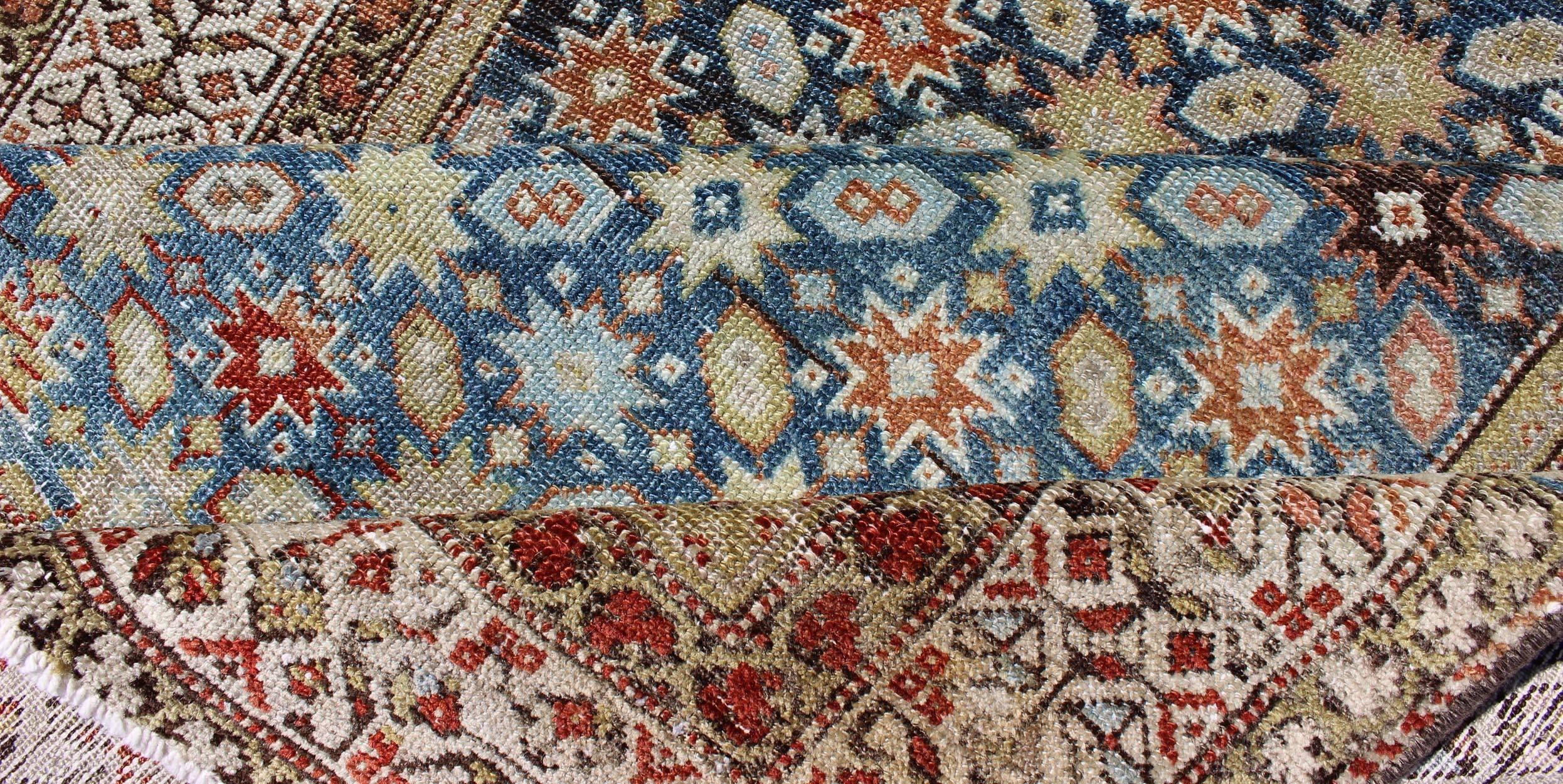 Early 20th Century Colorful Antique Persian Malayer Runner with Blue Background, Floral Motifs For Sale