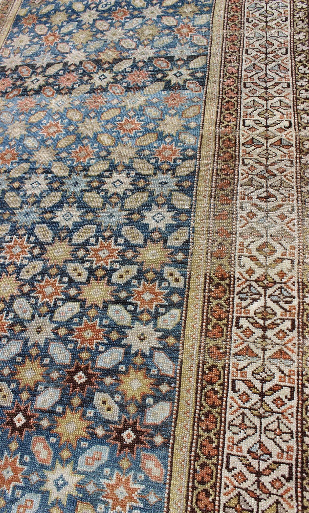 Wool Colorful Antique Persian Malayer Runner with Blue Background, Floral Motifs For Sale