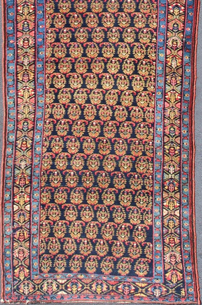 All-over Palmette design antique Malayer Runner from Persia in multi-colors, keivan Woven Arts/rug ema-7585, country of origin / type: Iran / Mahal, circa 1910

This antique Persian Malayer runner, circa early 20th century, relies heavily on