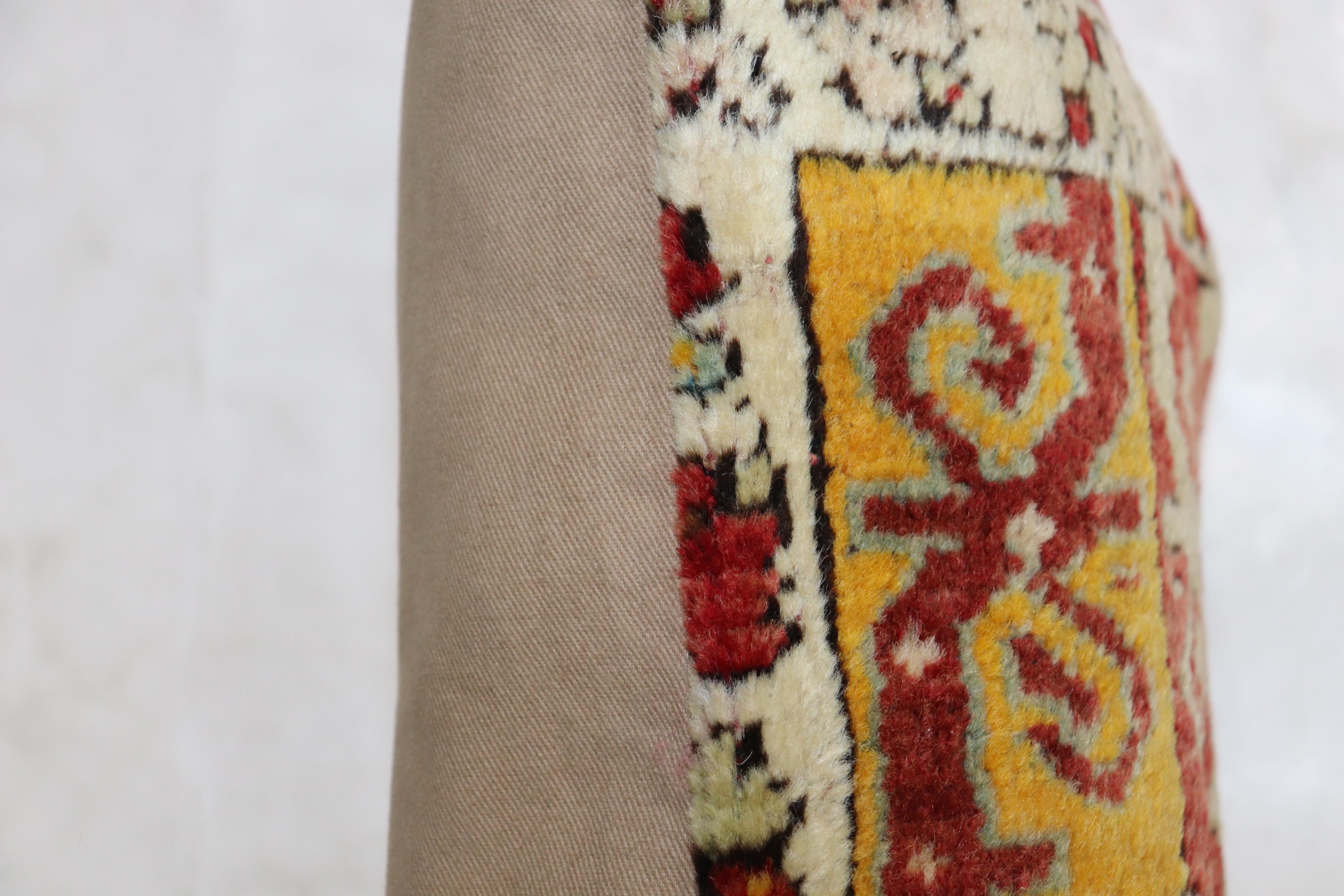 Pillow made from an early 20th-century Turkish ghiordes rug.

Measures: 12