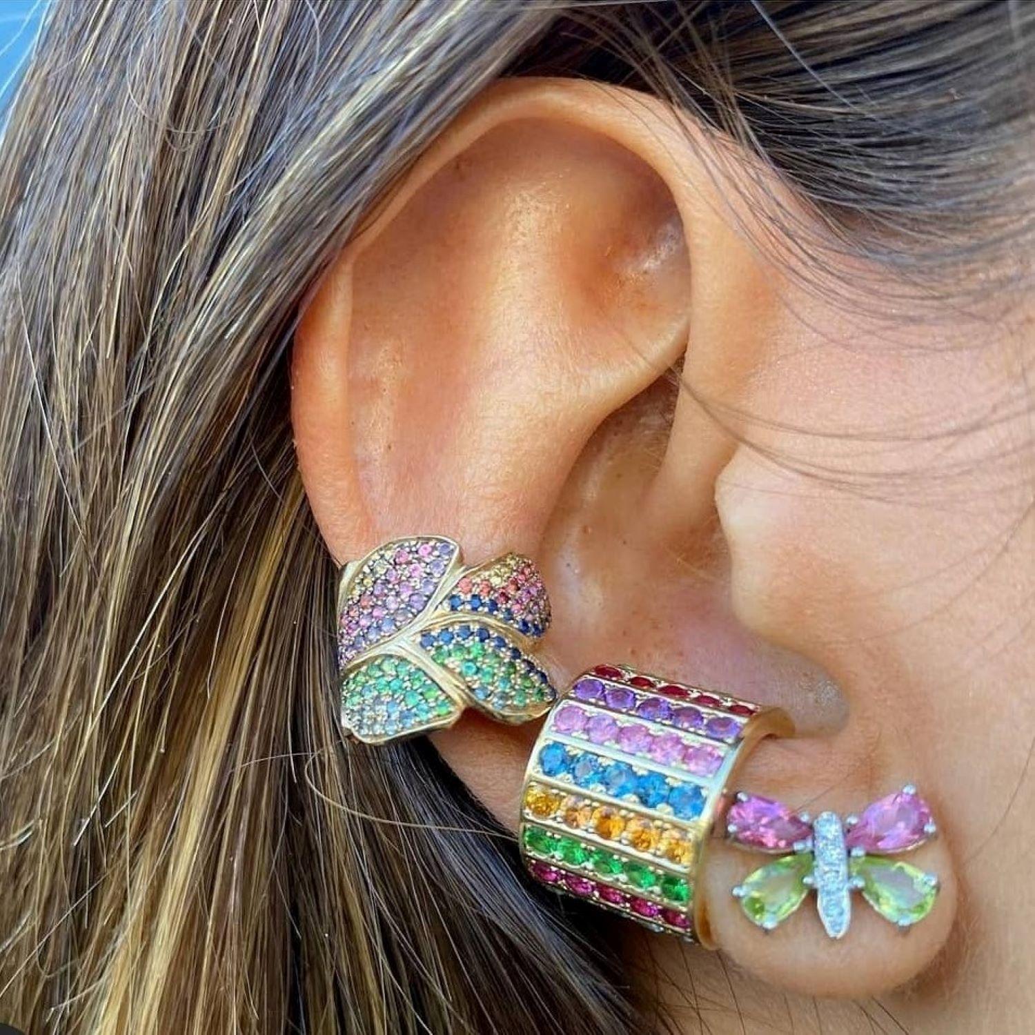 Alison Nagasue translated her love of Butterflies into these beautiful and colorful earrings. The color mix is universal with harmonious quiet Peridot and Pink Tourmaline. With the addition of a diamond pave body, it is just enough sparkle. 14K