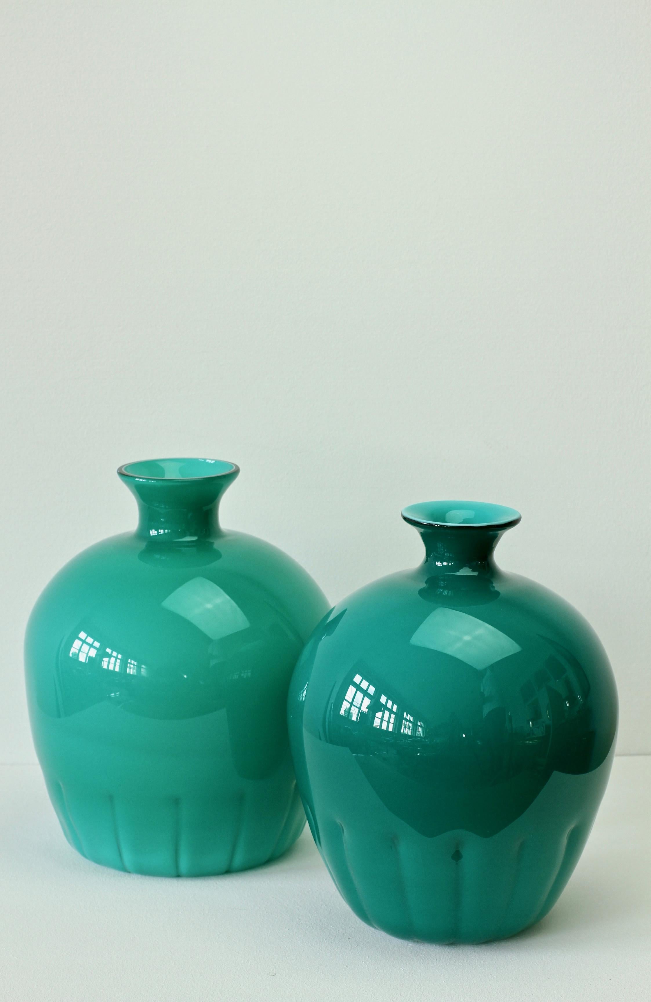 Colorful (colorful) pair, group or ensemble of midcentury teal green vases by Cenedese Vetri of Murano, Italy, circa 1970s-1990s. Particularly striking is the narrow necked round form with rippled bases, very similar to Napoleone Martinuzzi bowls