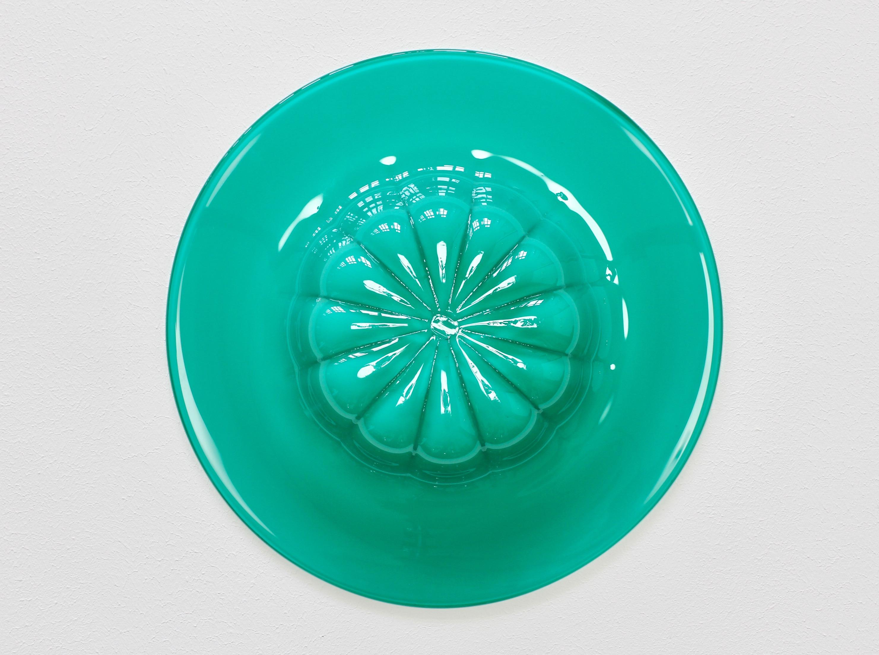 Colorful (colorful) midcentury turquoise green serving bowl or dish attributed to Cenedese Vetri of Murano, Italy, circa 1970s-1990s. Large rim or edge with a rippled base, very similar to Napoleone Martinuzzi bowls for Venini in the 1920s.

A