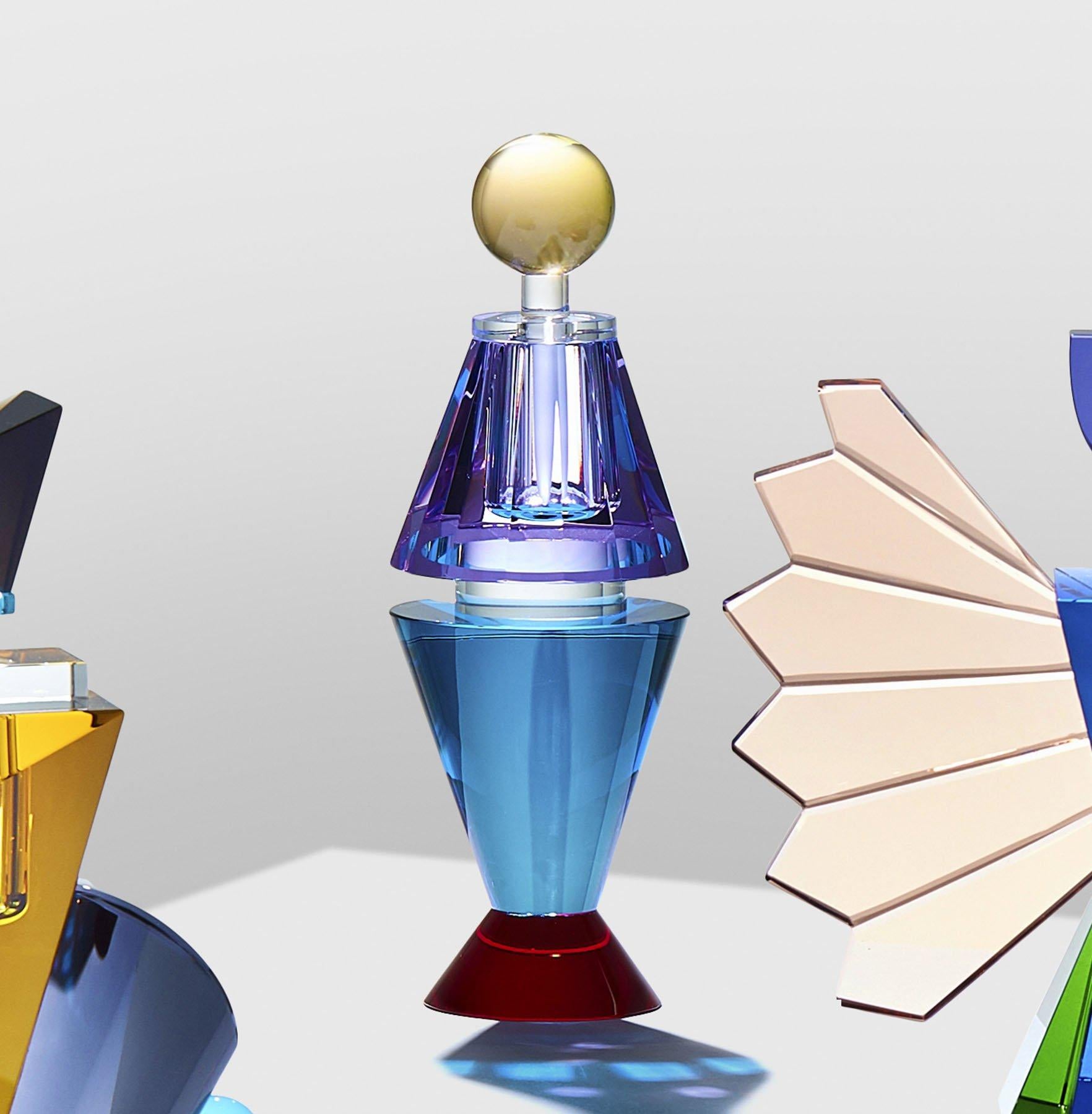 Colorful crystal perfume flacon, hand-sculpted contemporary crystal
Hand-sculpted in crystal
Measures: Small
Height 20 cm
Width 7 cm
Depth 7 cm
Weight 0.8 kg
Material: fine handcut crystal

The collection has 4 fine handcut crystal perfume