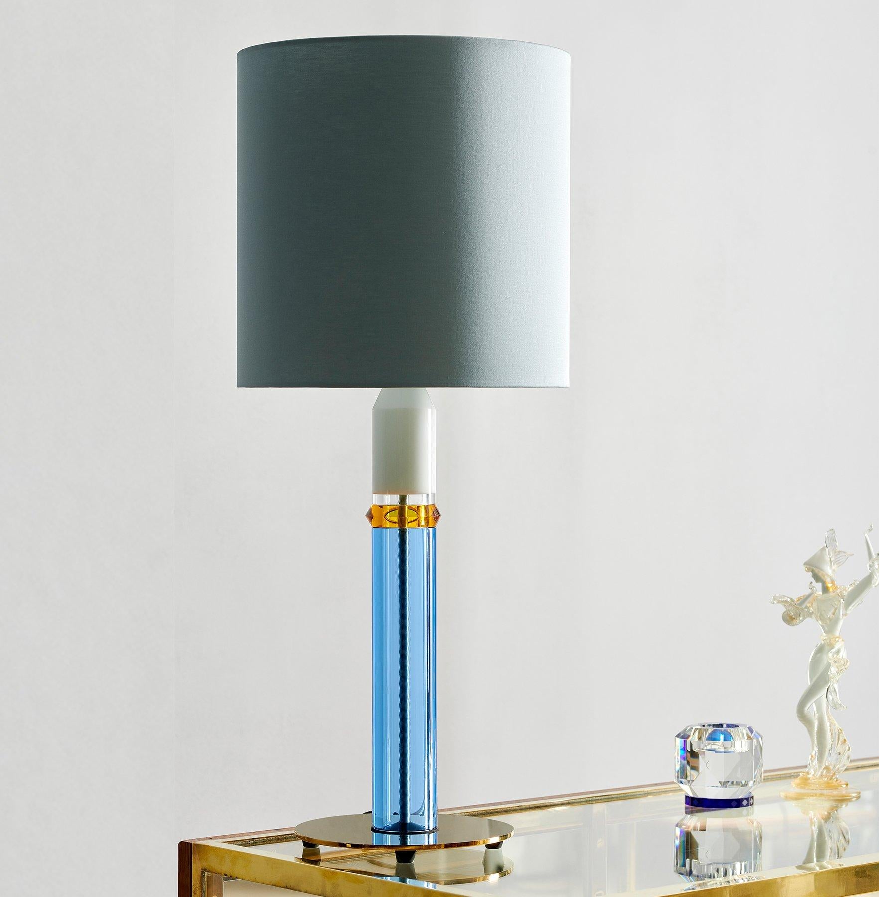 Colorful crystal table lamp, hand-sculpted contemporary crystal
Hand-sculpted in crystal
Measures: Height 72 cm
Width 30 cm
Weight: 3.5 kg
Material: Fine hand cut crystal and brass coated iron

With blasting colour combinations, a brave