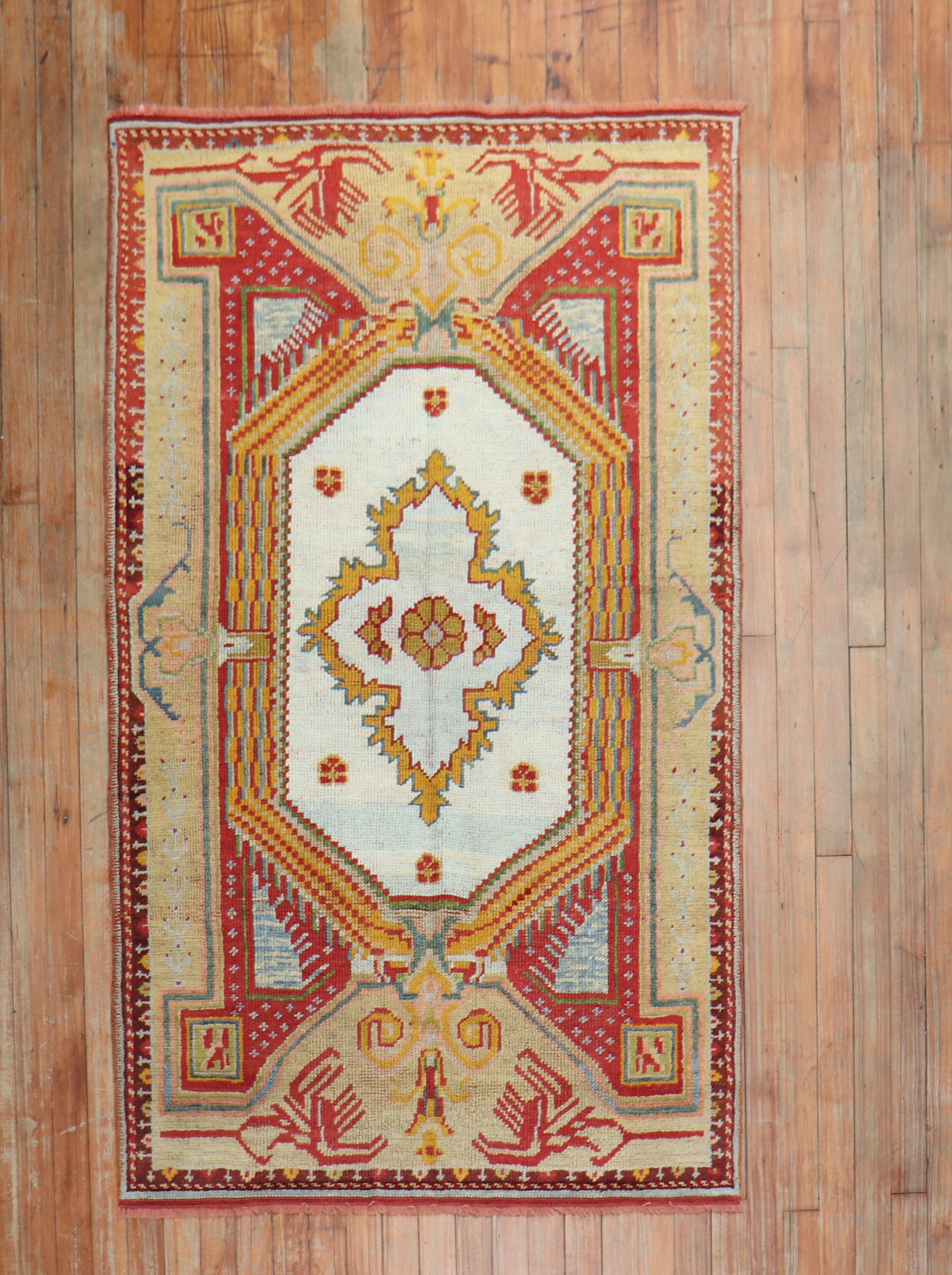 A colorful antique Turkish Ghiordes rug from the second quarter of the 20th century.

Measures: 3'8'' x 5'5''

Since the beginning of their production in the 18th century, rugs from the Turkish town, Ghiordes have mostly been known for their