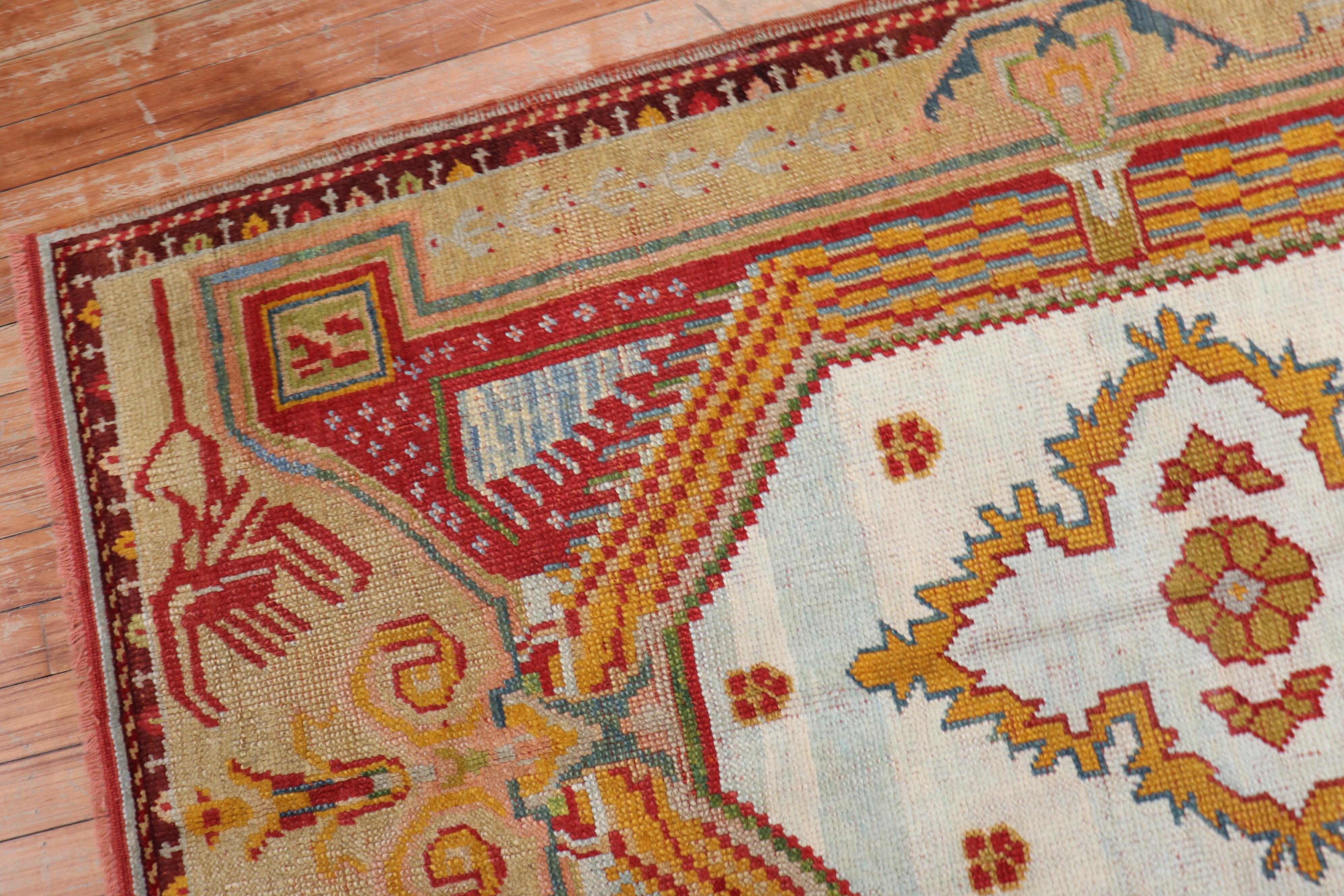 Elizabethan Colorful Early 20th Century Antique Turkish Ghiordes Rug For Sale