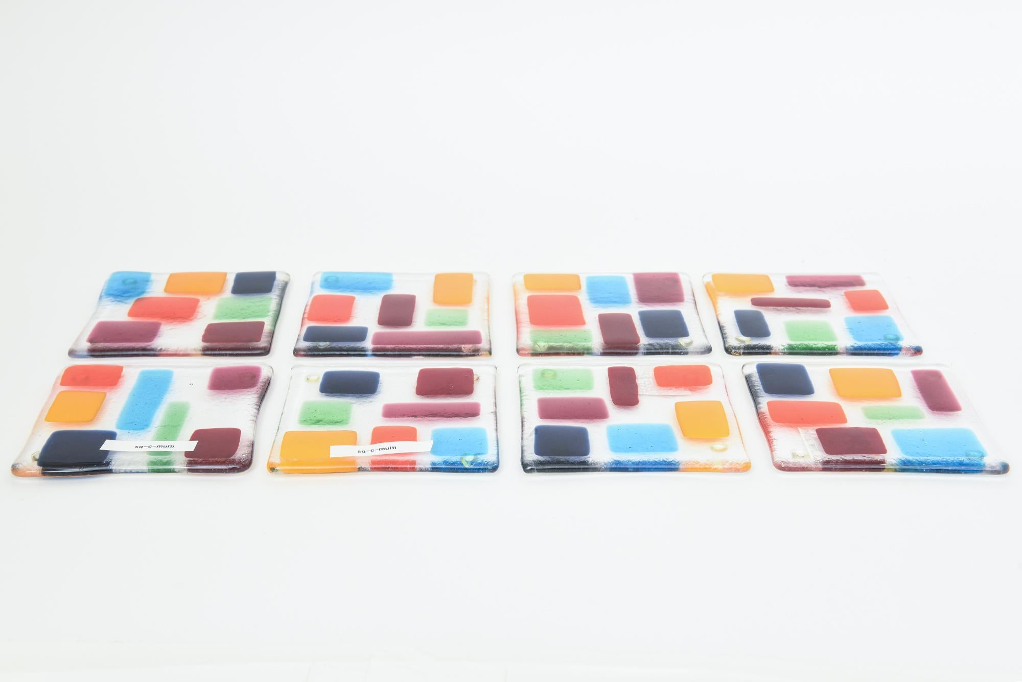 This set of fabulous and colorful glass block coasters are from the 90's and were never ever used. Brand new. They have the original stickers on them from Barneys and came on the Barney's box. What we were told is that they are by a wonderful glass