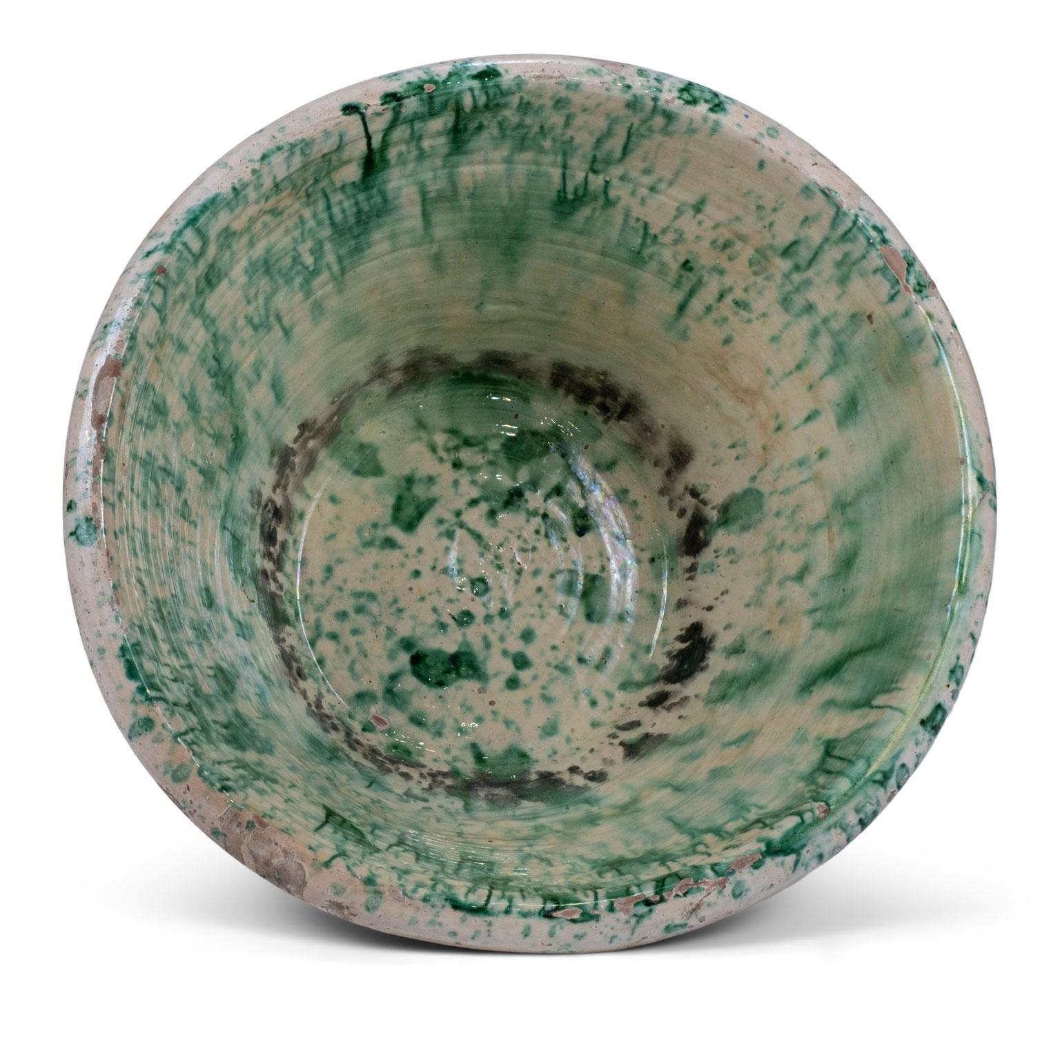 Colorful glazed terracotta passata bowl from Southern Italy (Puglia). This rustic 19th century terracotta bowl was used in the Italian countryside to make tomato passata. Handcrafted and glazed in a pesto-color green pattern over butter-cream.