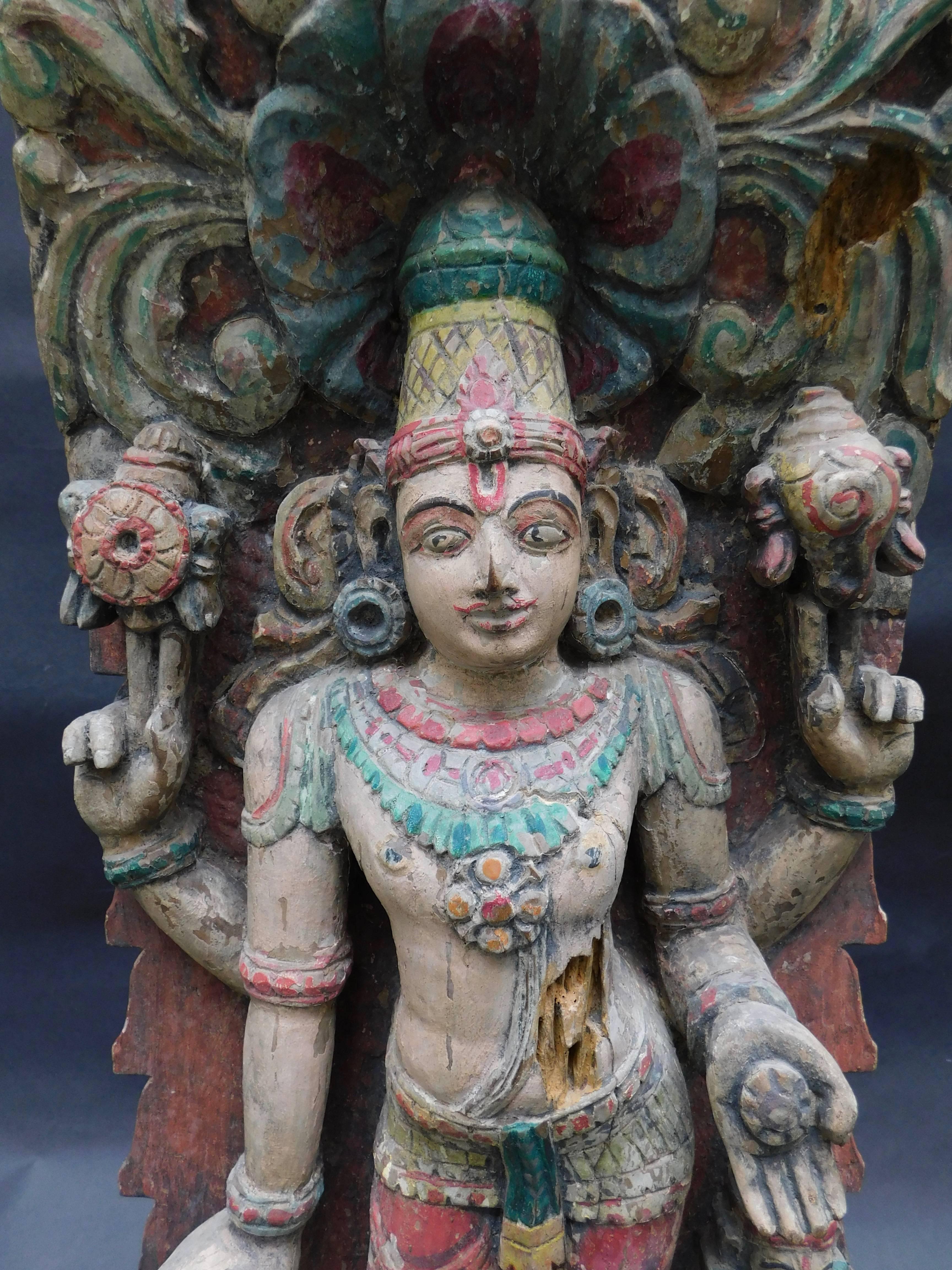 
An antique hand carved wood temple statue of Vishnu  preserver and protector of the universe. The statue retains its original paint and is able to stand on its own or can be hung .
 Vishnu is one of the most important gods in the Hindu pantheon