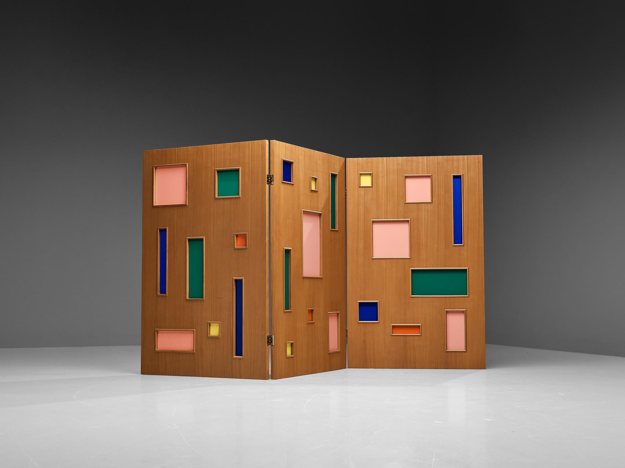 Room divider, plexiglass, beech, Italy, 1970s 

Elevate the vibrancy of your interior with this whimsical room divider crafted from wood and adorned with colored plexiglass panels in green, blue, red-orange, yellow, and salmon pink. This sturdy yet