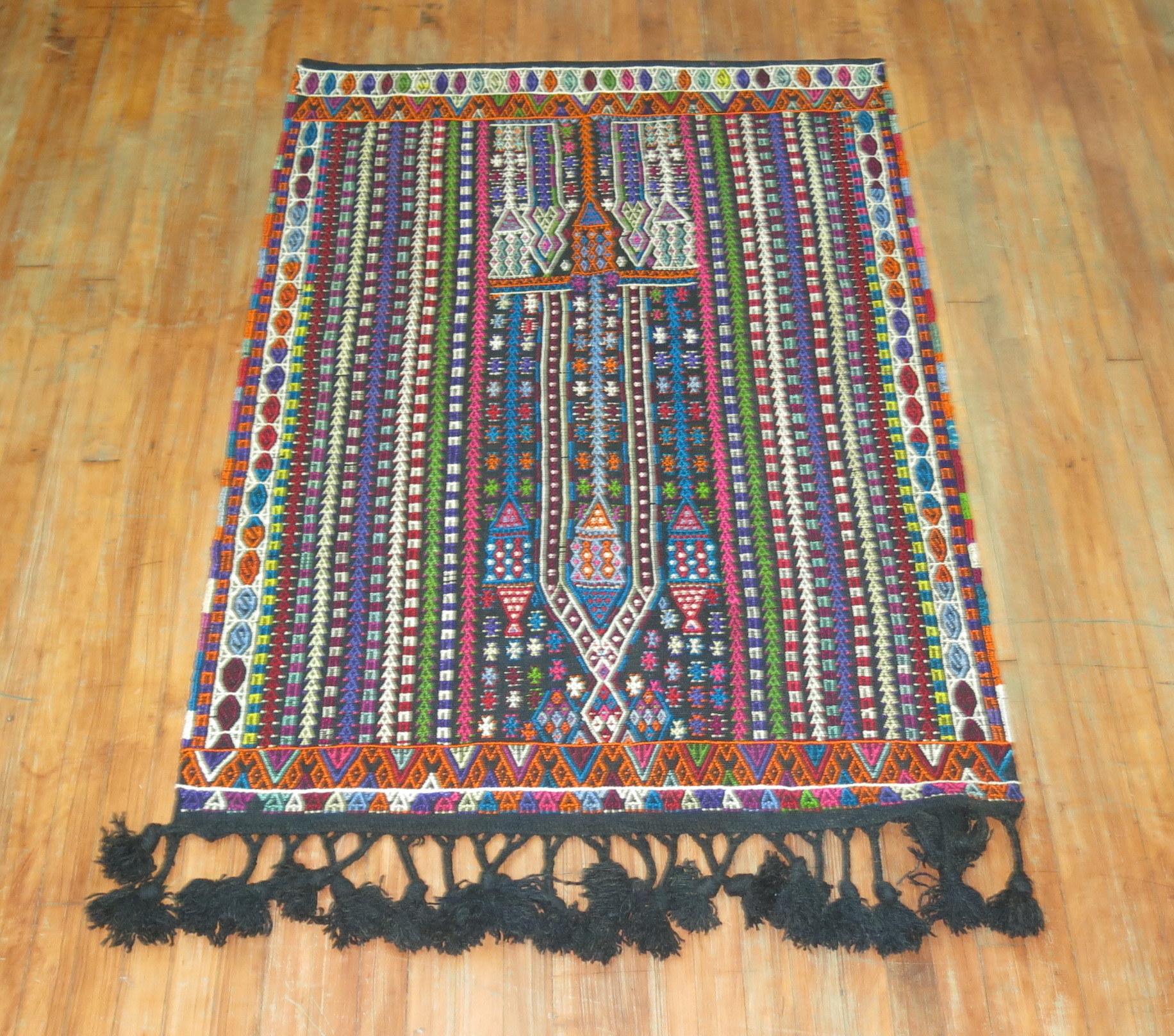 Colorful midcentury Turkish Jajim also known as Jijim.

Measures: 3'7” x 4'11”

With the Jijim weaving technique, different colored threads are applied between the weft and warp threads, on the reverse of the weave. It is often used to decorate