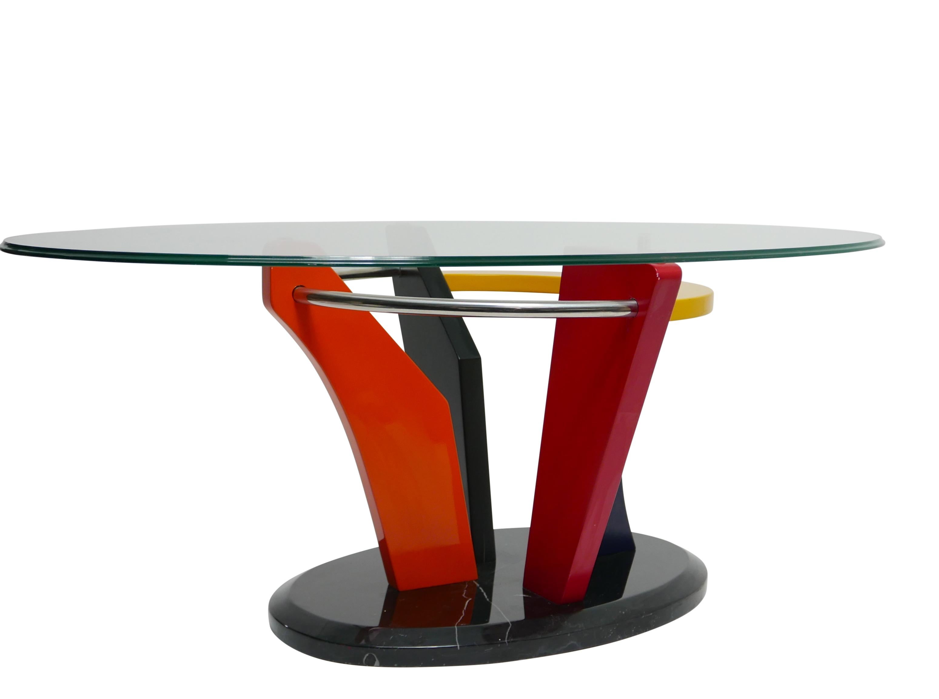Very vibrant and bold Memphis lacquered and polished marble base with oval glass top coffee table, Completely intact and original, glass top has some light scratches, no chips. American, Circa 1980's.
This is not a Peter Shire, but is very similar.