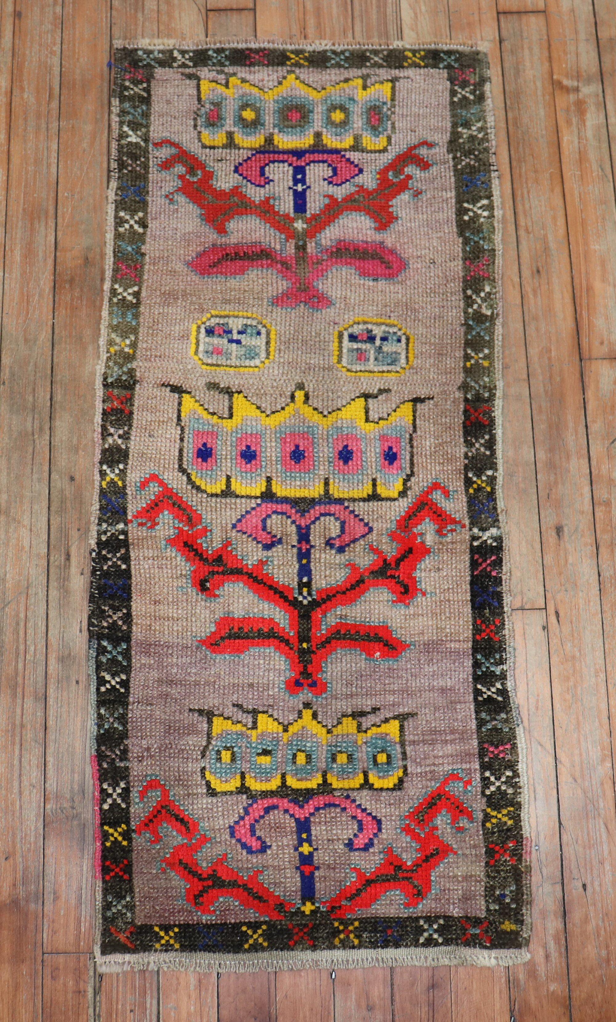 Quirky vintage Turkish Anatolian floral rug featuring vibrant colors on a brown field

Measures: 1'5' x 3'5