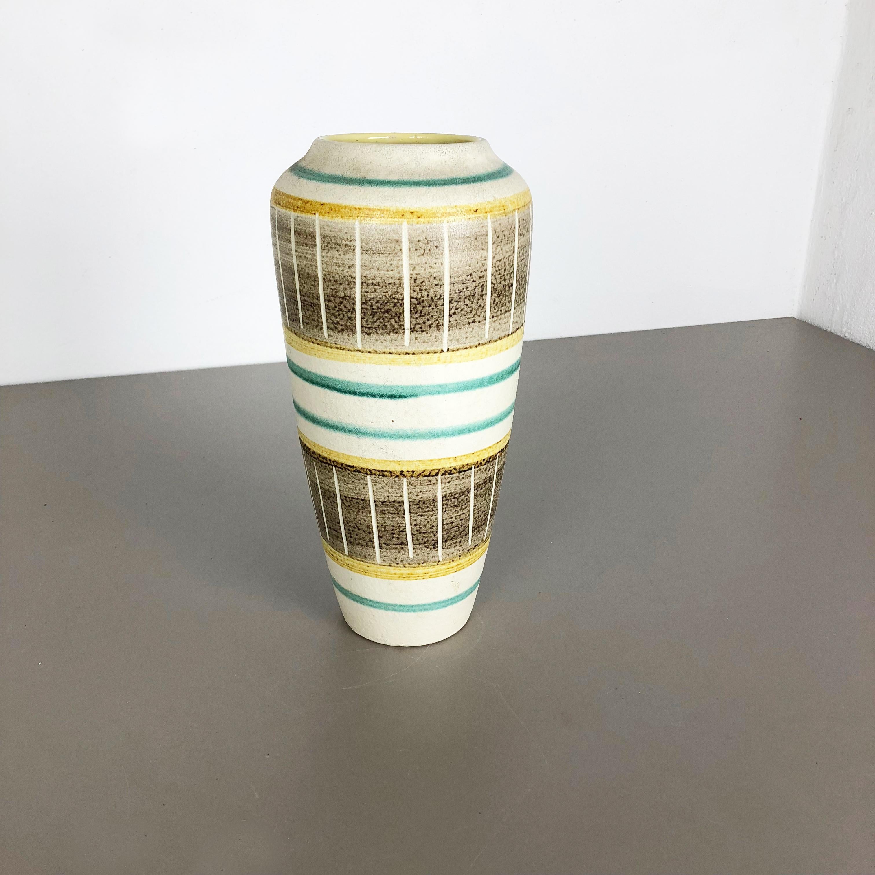 Article:

Pottery ceramic vase


Producer:

BAY ceramic, Germany



Decade:

1960s




Original vintage 1960s pottery ceramic vase made in Germany. High quality German production with a nice abstract painting and super colorful