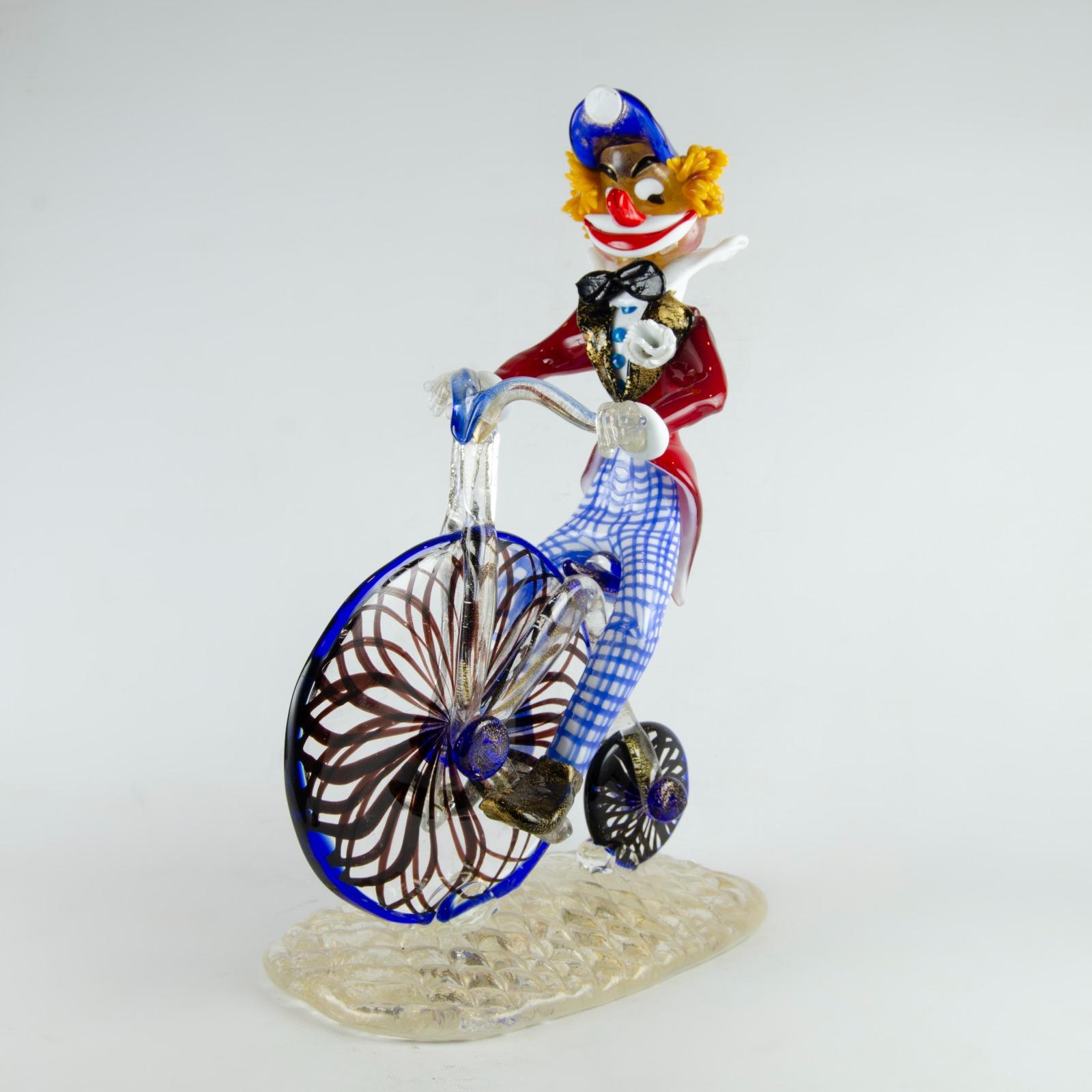 Beautiful murano glass figurine of a clown riding a bicycle, perfect for those collectors who have a special love for them.

high: 40 centimeters
width: 24 centimeters 
Depth: 15 centimeters
