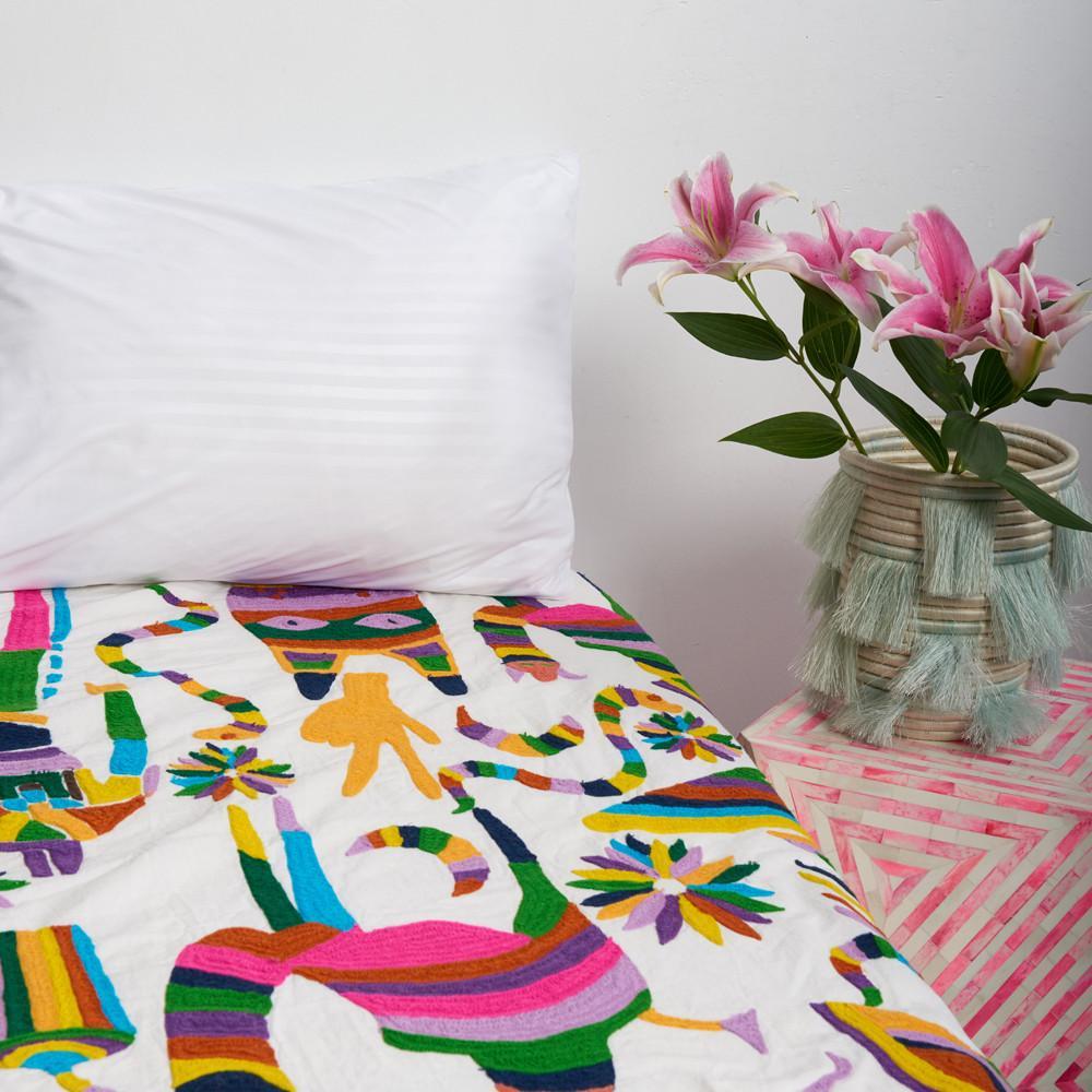 
100% cotton. Medium weight. 300 thread count.

Embroidered textile inspired by late nights spent loitering in 711 and tales of ayahuasca trips abroad. Adorn your bed or your wall with this imaginative twist on Classic otomi embroidery.

Queen