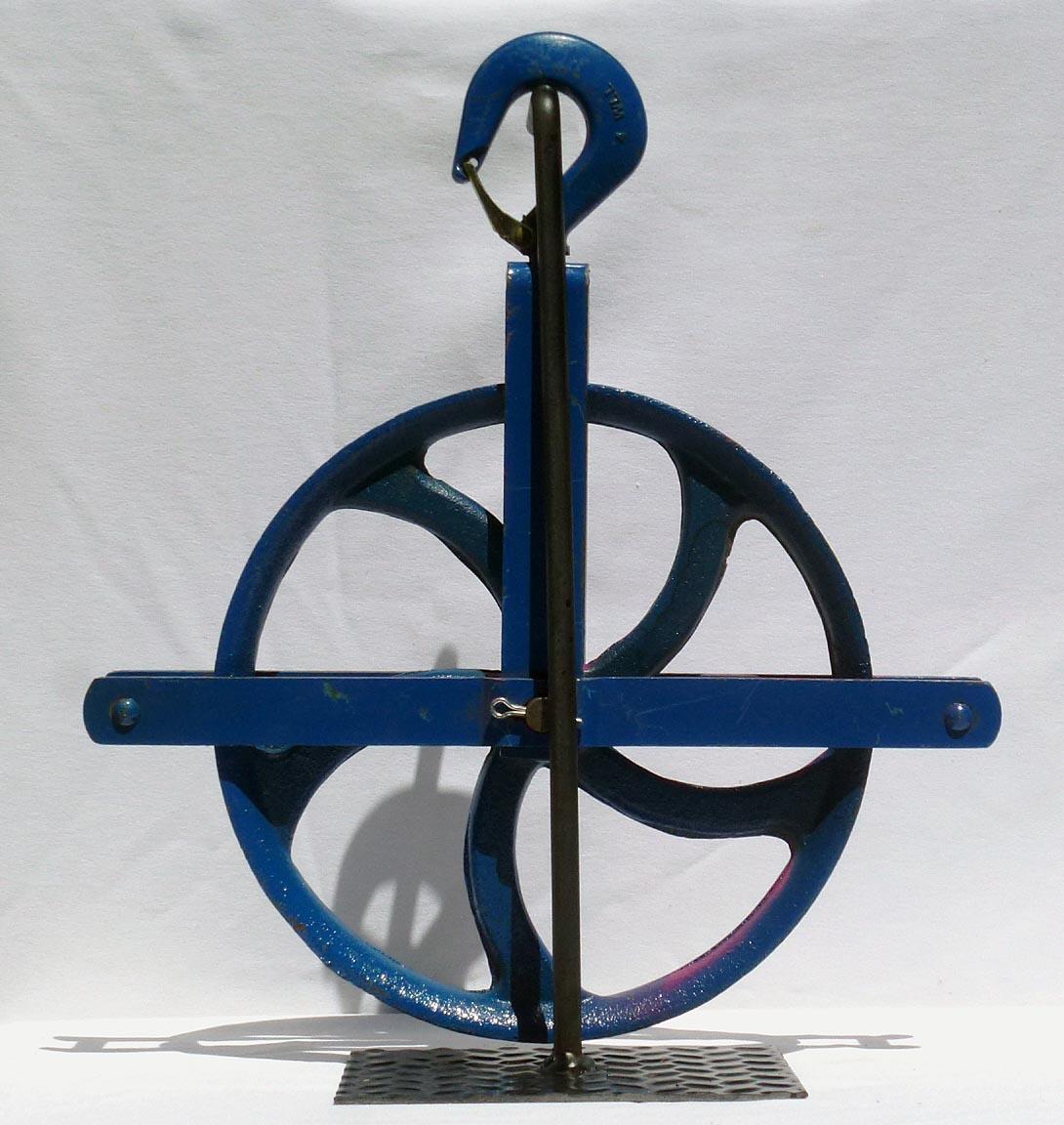 Forged Colorful Painted Bright Blue Large Industrial Cast Iron Pulley on a Metal Base For Sale