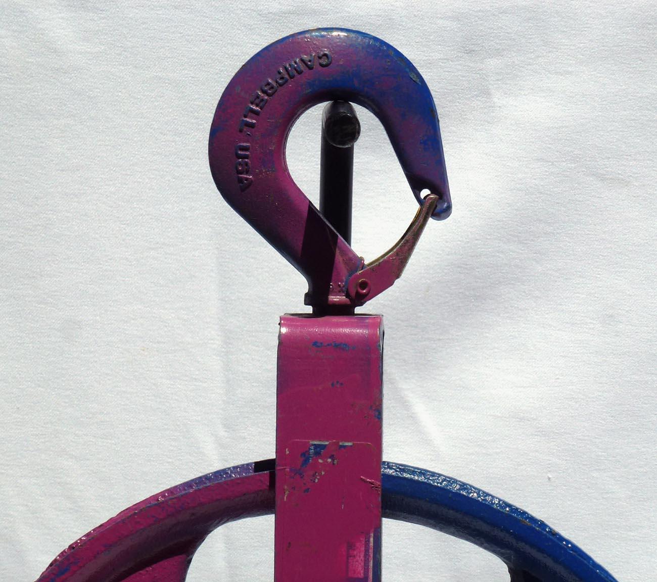 Late 20th Century Colorful Painted Bright Blue Large Industrial Cast Iron Pulley on a Metal Base For Sale