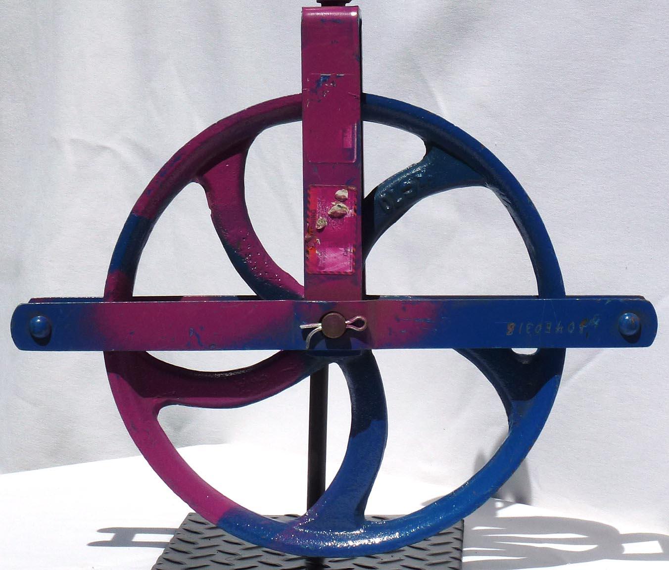 Colorful Painted Bright Blue Large Industrial Cast Iron Pulley on a Metal Base For Sale 1