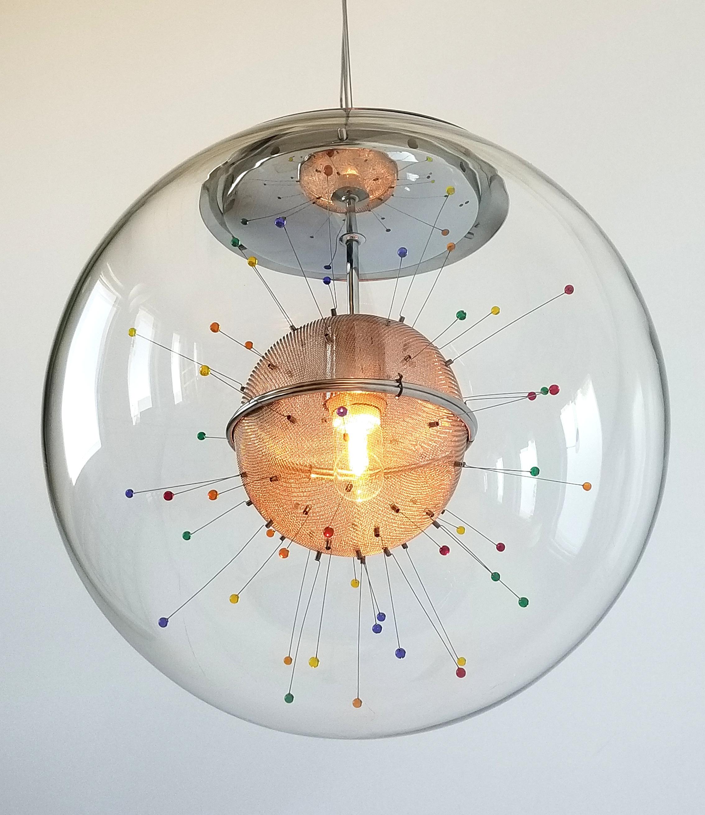 Colorful plastic droplet hanging at the tip of a springned wire enclosed in a thick glass shade. 

Well made solid construction with prime quality hardware. 

Shade measure 15 inches diameter. 

Height adjustable with an efficient sliding