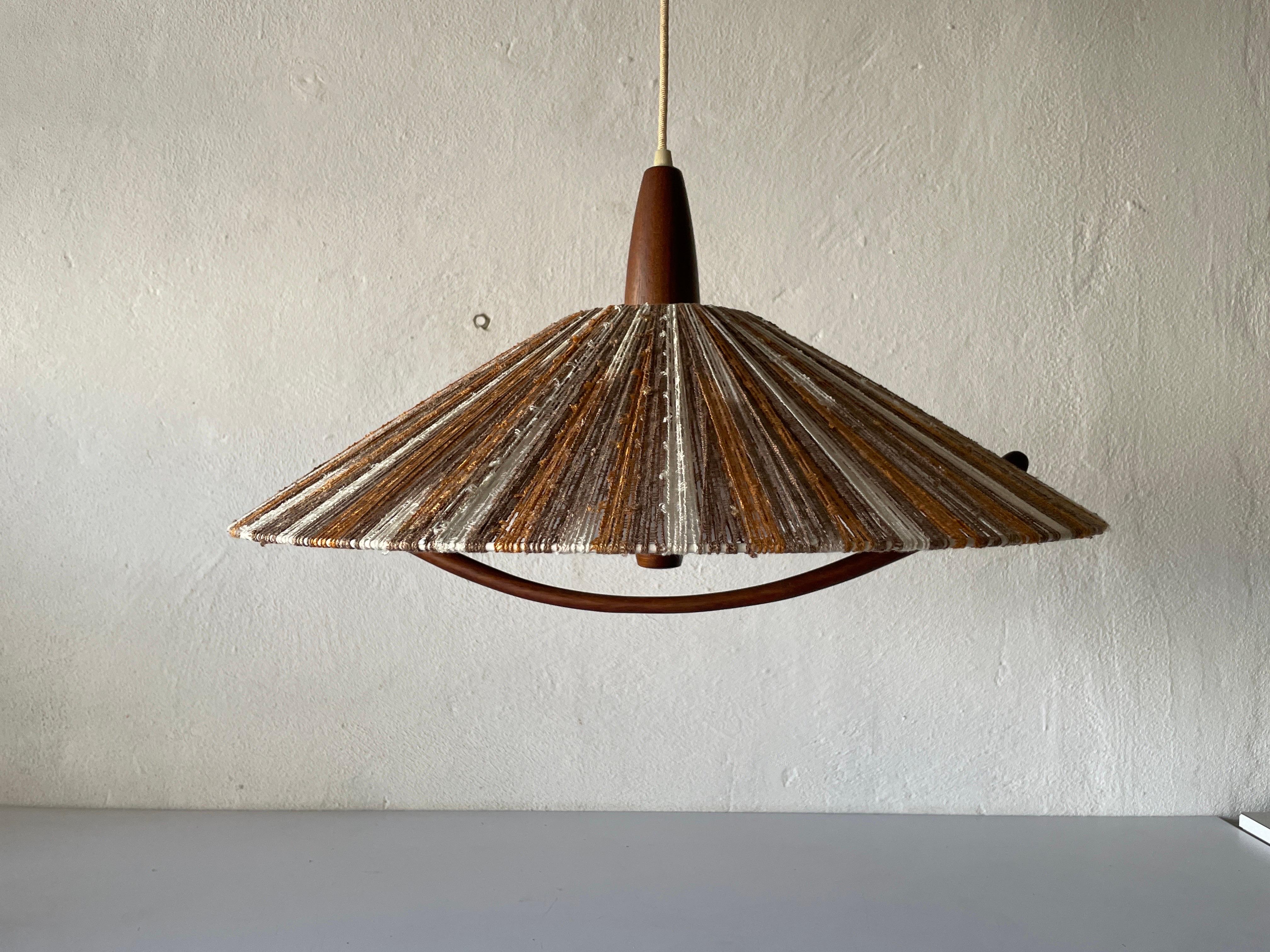 Colorful raffia bast and teak pendant Llamp by Temde, 1960s, Germany.

Lampshade is in very good vintage condition.

This lamp works with E27 light bulb. Max 100W
Wired and suitable to use with 220V and 110V for all