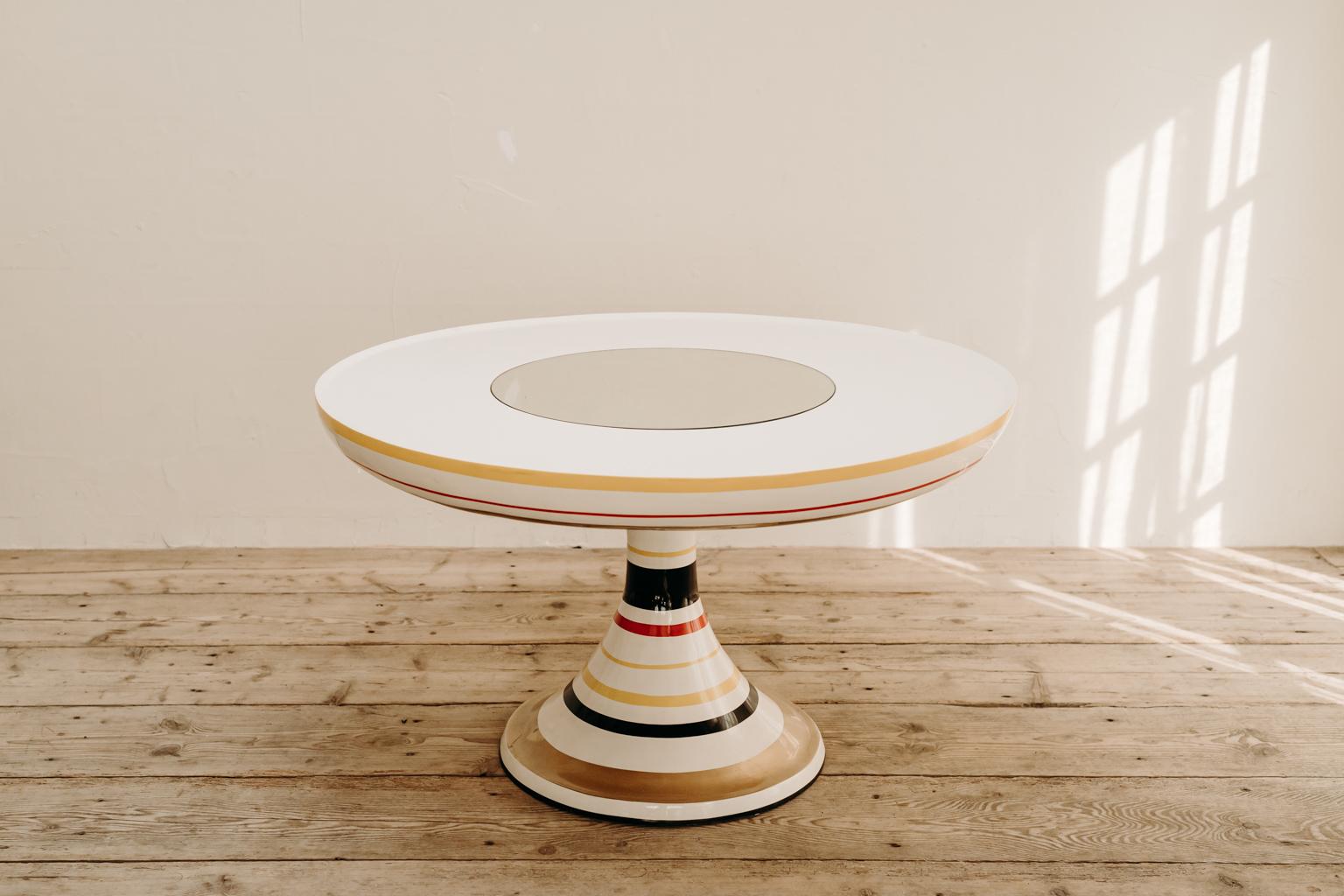A rare find this table, called Dulan, made in polyester and glass, Italy early 2000's, designed by Italian architect
Valentina Audrito. The round surface of the top as well as the base are decorative hand-painted. The top is equipped with a round