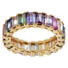Colorful sapphire eternity band in yellow gold