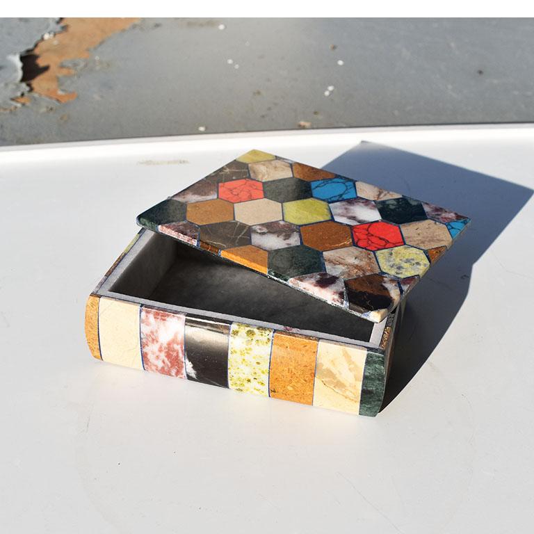 A beautiful colorful decorative box with a lid created from Carrara marble and inlaid with a variety of semi-precious stones. The sides are inlaid with a variety of stones in abstract colors in a fun vertical stripe pattern. The top is inlaid with