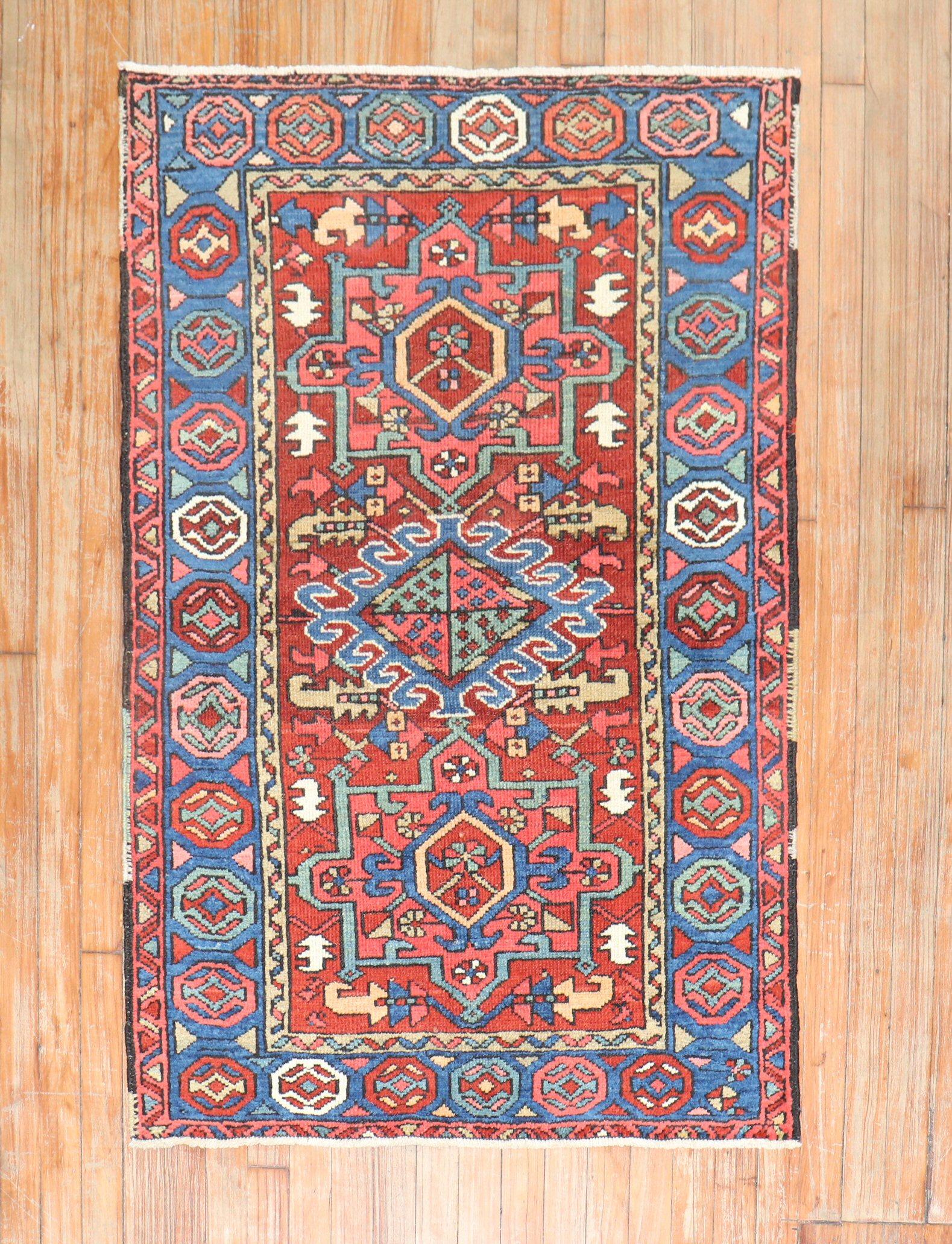 An early 20th-century Persian Heriz karadja small rug with cheerful colors

Measures: 2'11'' x 4'4''.