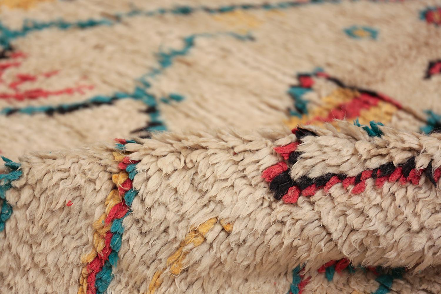 Breathtakingly colorful small size vintage Moroccan rug, country of origin / rug type: Morocco, date: circa mid-20th century. Size: 4 ft 2 in x 7 ft (1.27 m x 2.13 m)

This fanciful and cheerful vintage Moroccan rug would be a delightful addition to