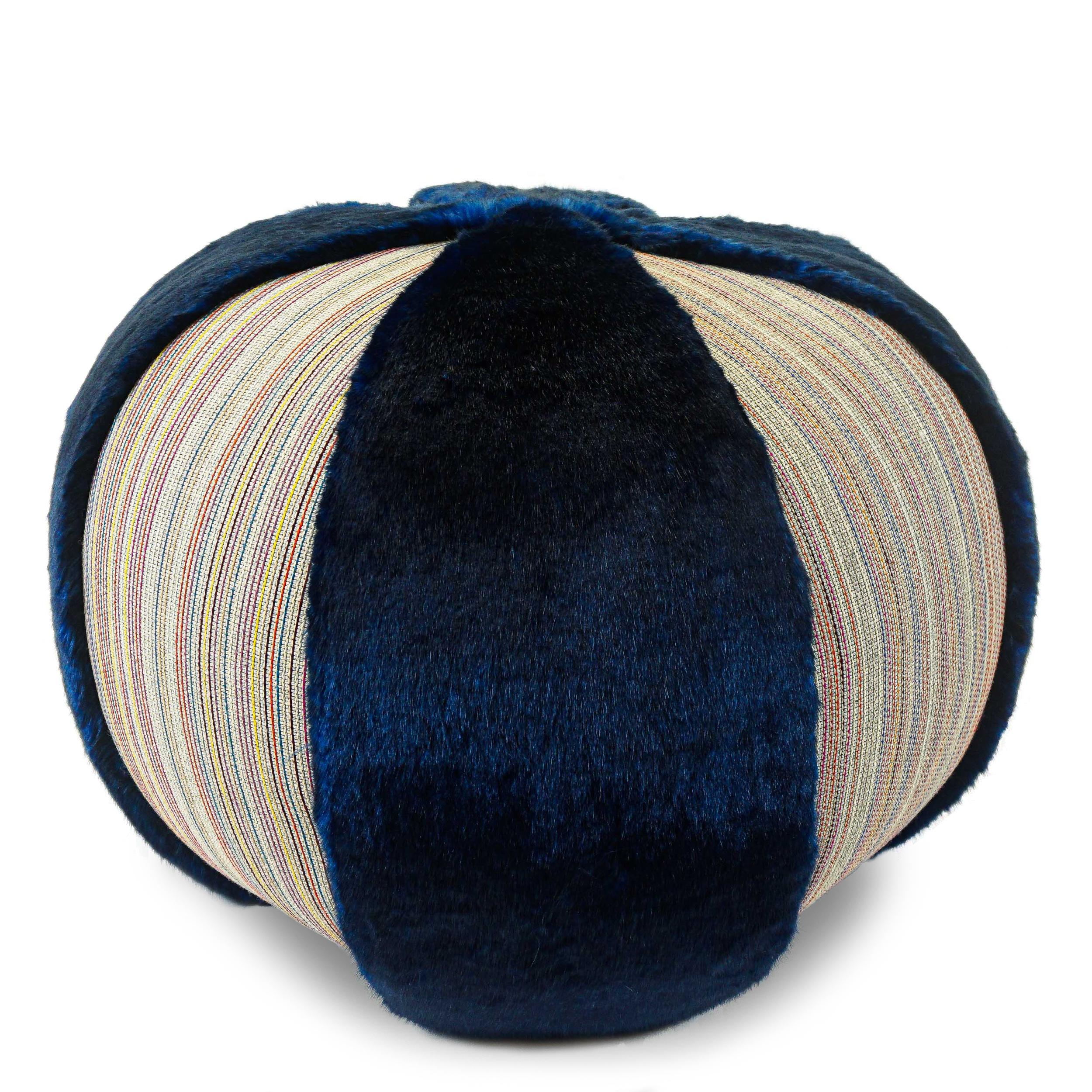 Handmade pouf/ottoman covered in vibrant blue faux fur & colorful textured stripe fabric. Light-weight enough to move around as occasional seating without scratching floor, but substantial and firm enough to support a serving tray or adult size