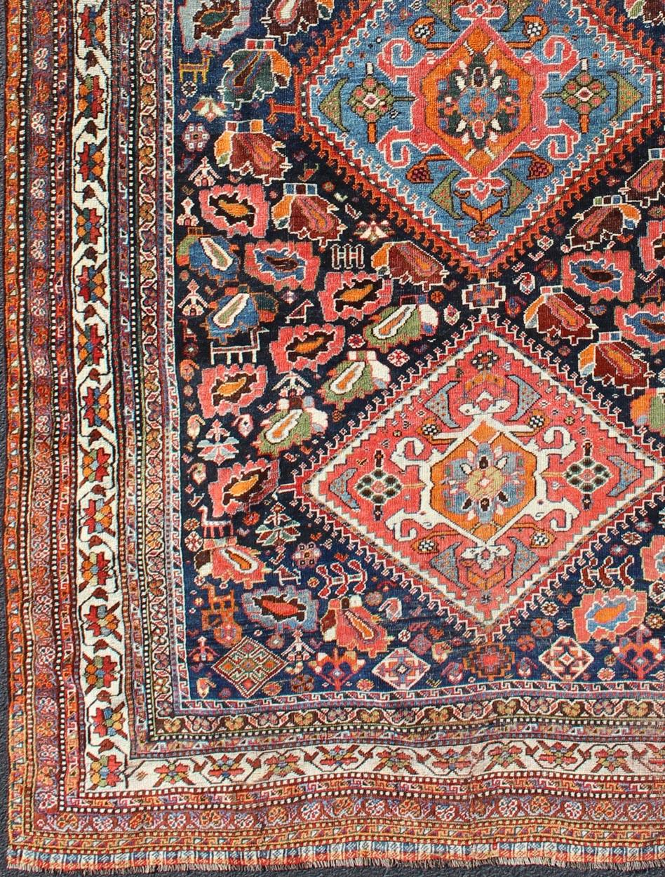 Qashqai rug antique from Persian with detailed and colorful Tri-Medallion design, rug ema-7589, country of origin / type: Iran / Qashqai, circa 1900.

The Qashqai nomads are found in the Fars province in southwest Iran. They move twice a year,