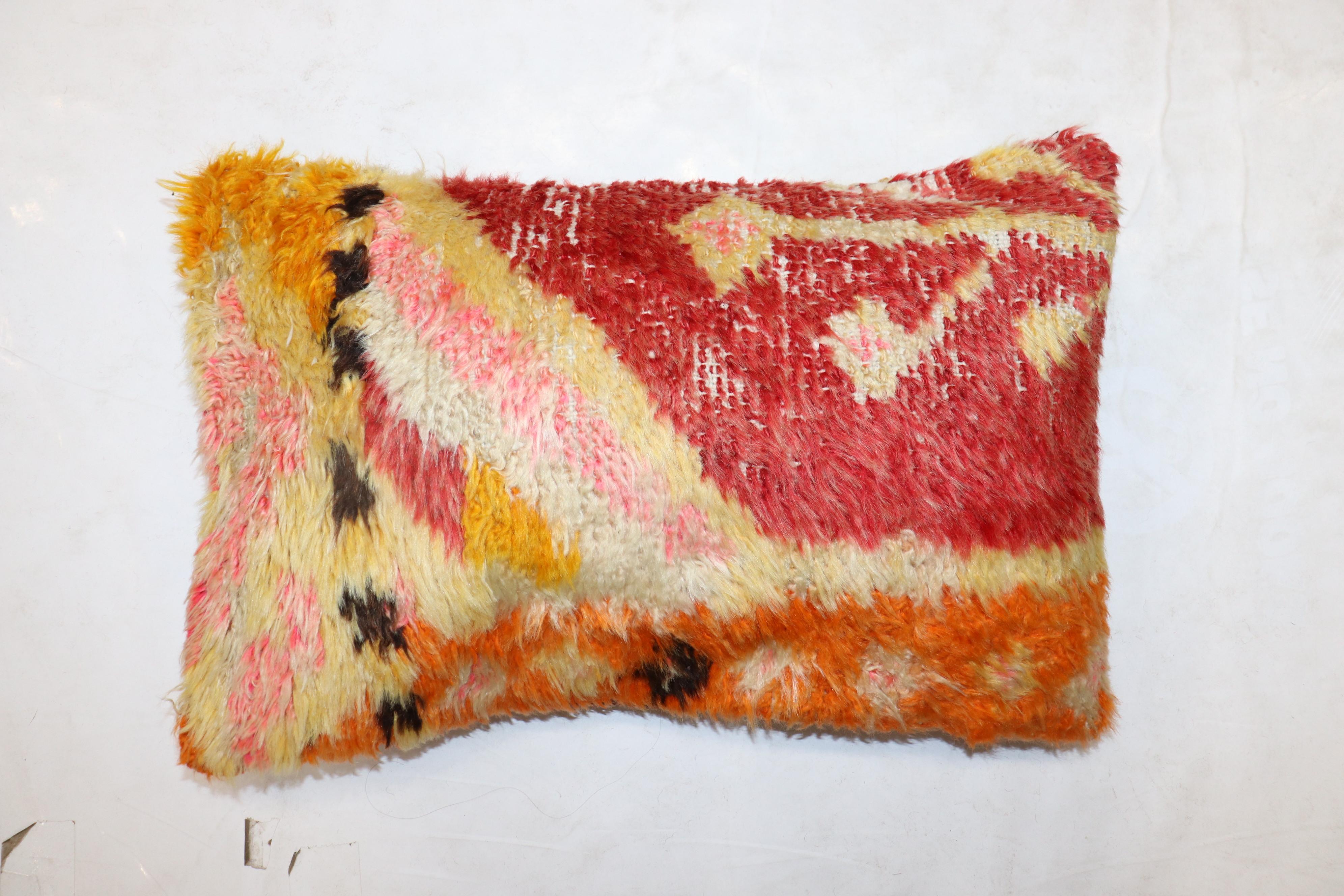 Bolster size Pillow made from a mid 20th century Turkish Tulu rug. PolyFill insert and zipper closure provided.

Measures: 14'' x 22''.