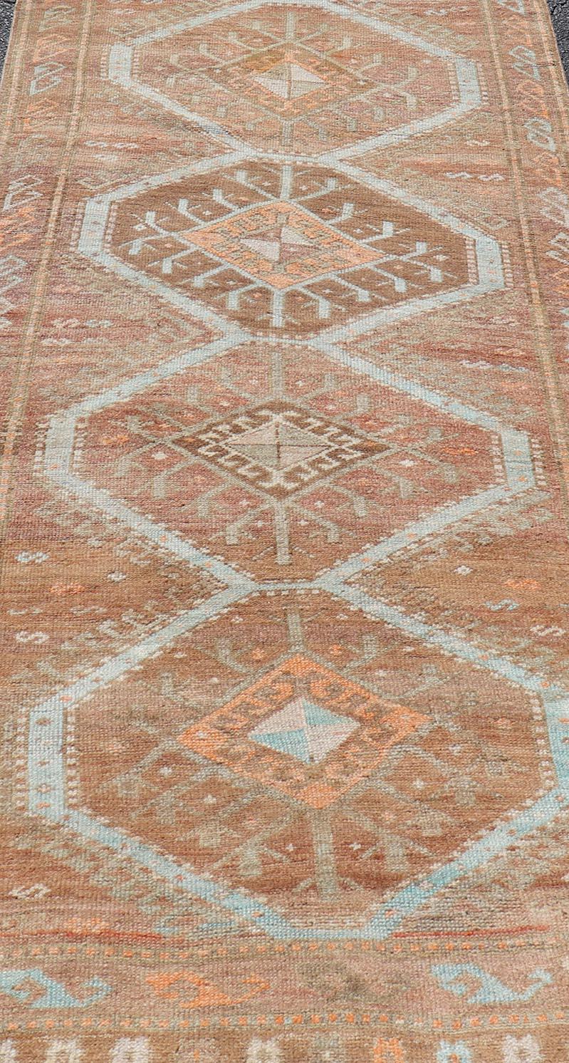 Wool Colorful Turkish Kars Runner in Softer Tones with Tribal and Geometric Motifs For Sale
