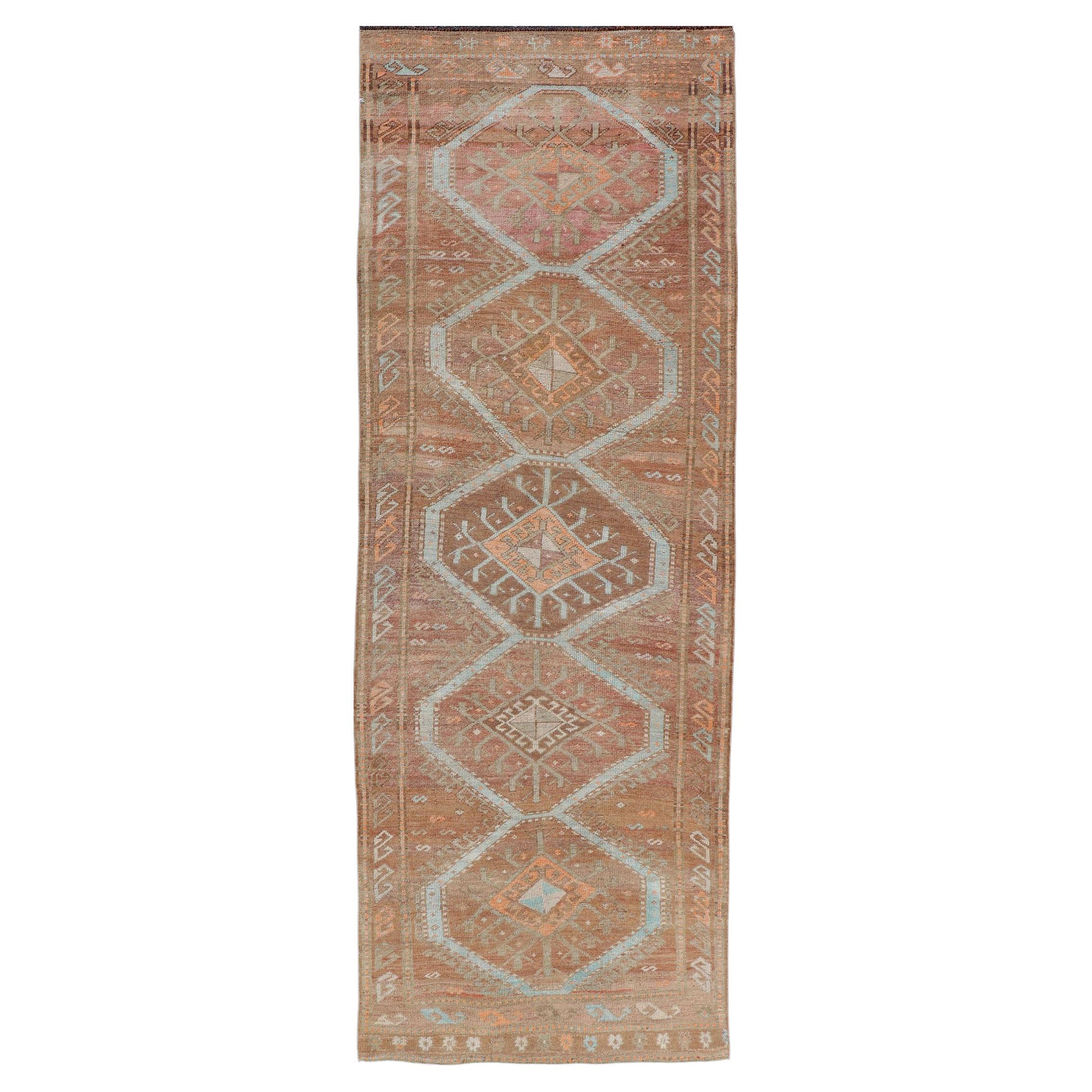 Colorful Turkish Kars Runner in Softer Tones with Tribal and Geometric Motifs For Sale