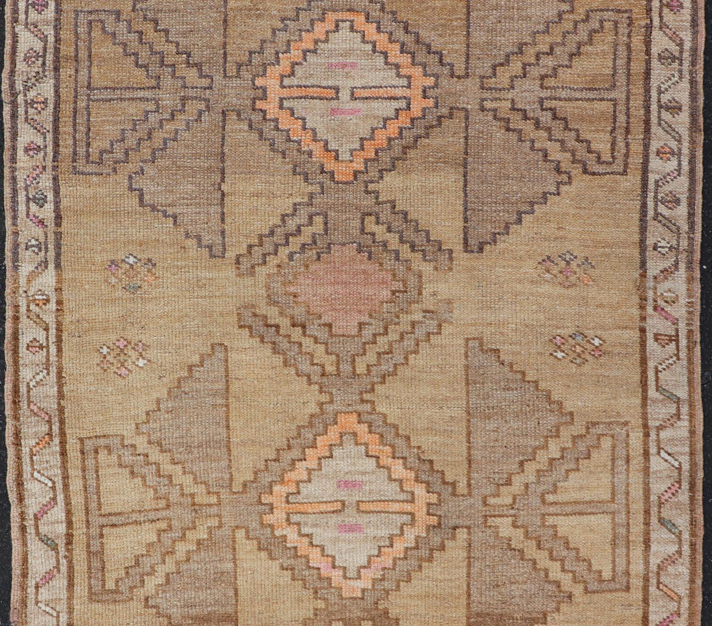 Colorful Turkish Kars with Tribal Medallion Designs and Geometric Motifs. Vintage Turkish in brown background and taupe border with accent colors, ornage, tan, cream, brown, and taupe. Keivan Woven Arts / rug /EN-15296, country of origin / type: