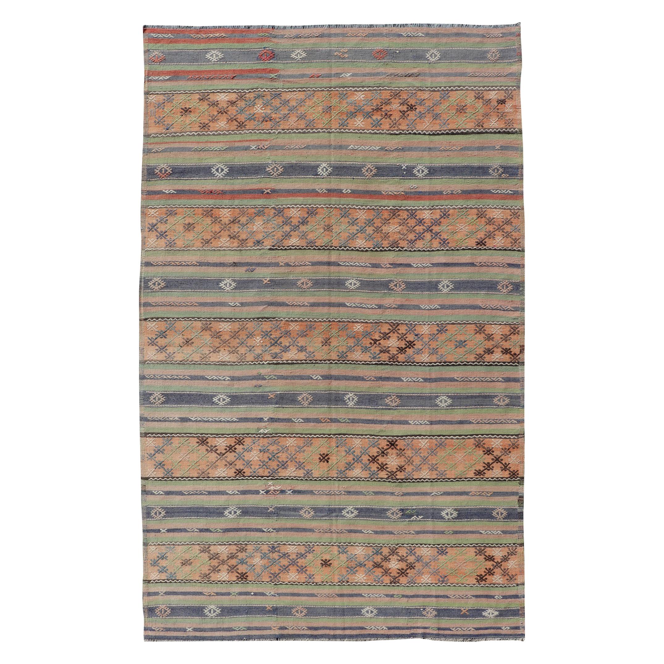 Colorful Turkish Kilim with Stripes and Geometric Elements in Orange and Green