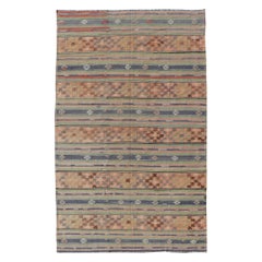 Colorful Turkish Kilim with Stripes and Geometric Elements in Orange and Green