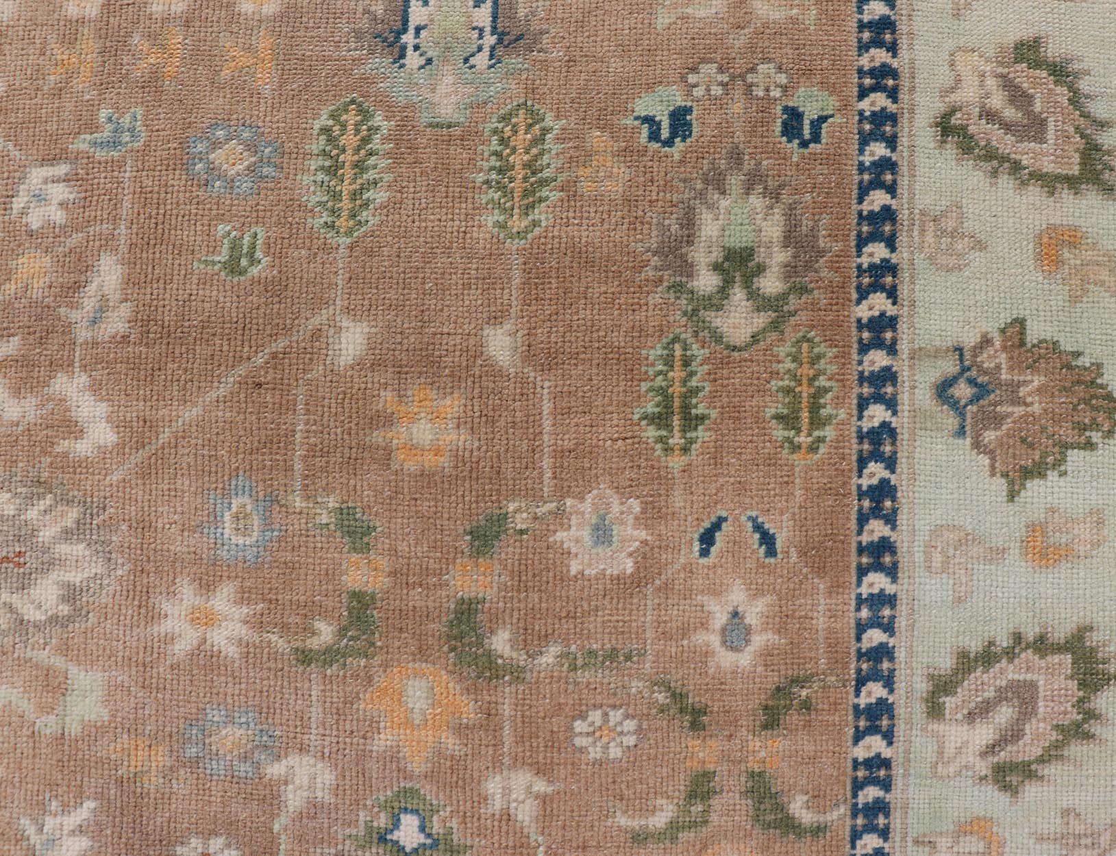 Colorful Turkish Oushak Rug in Salmon Background with All-Over Floral Design In Good Condition For Sale In Atlanta, GA